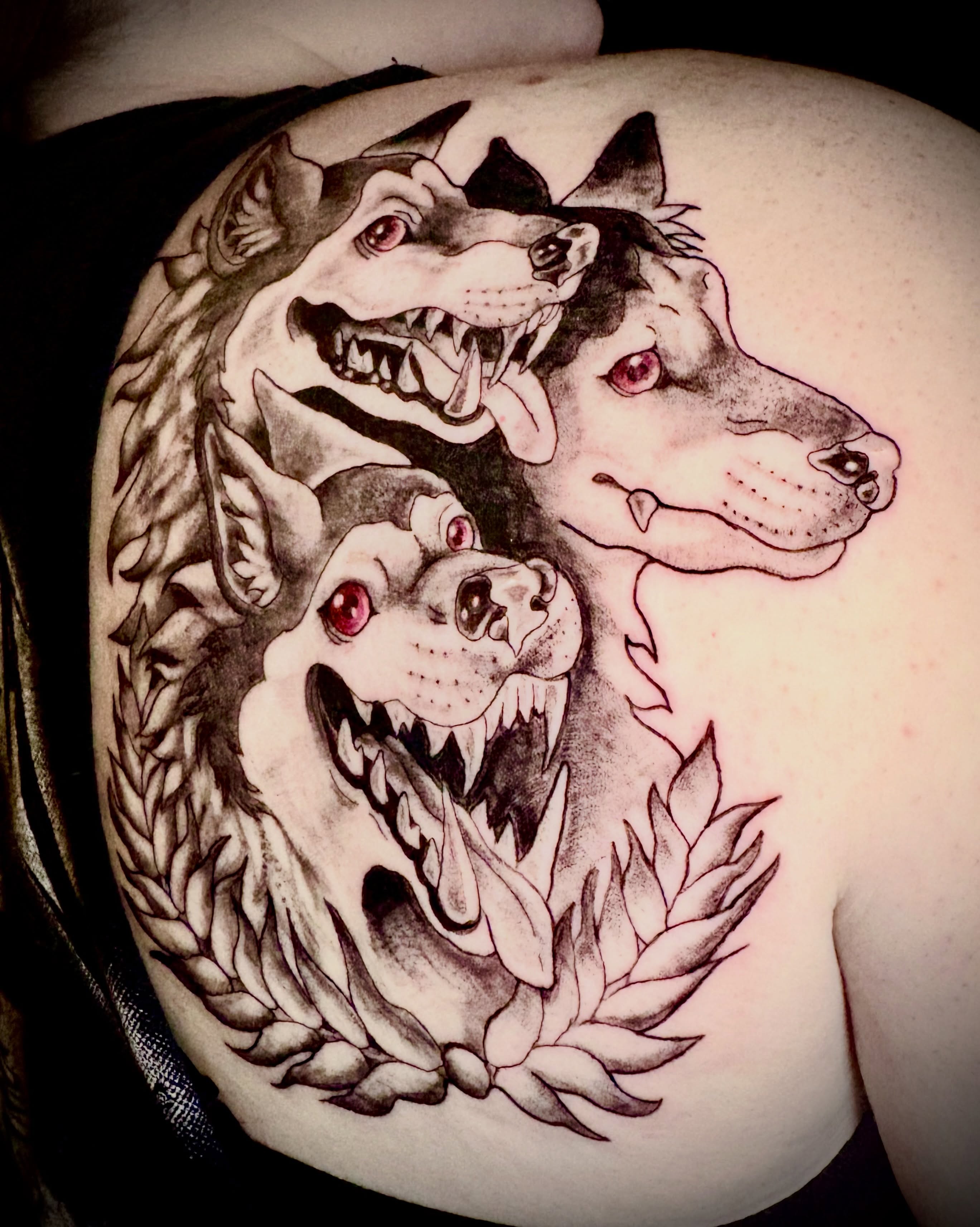 Three wolves black and grey tattoo on the shoulder by Abby Ruok, Midvale, Utah