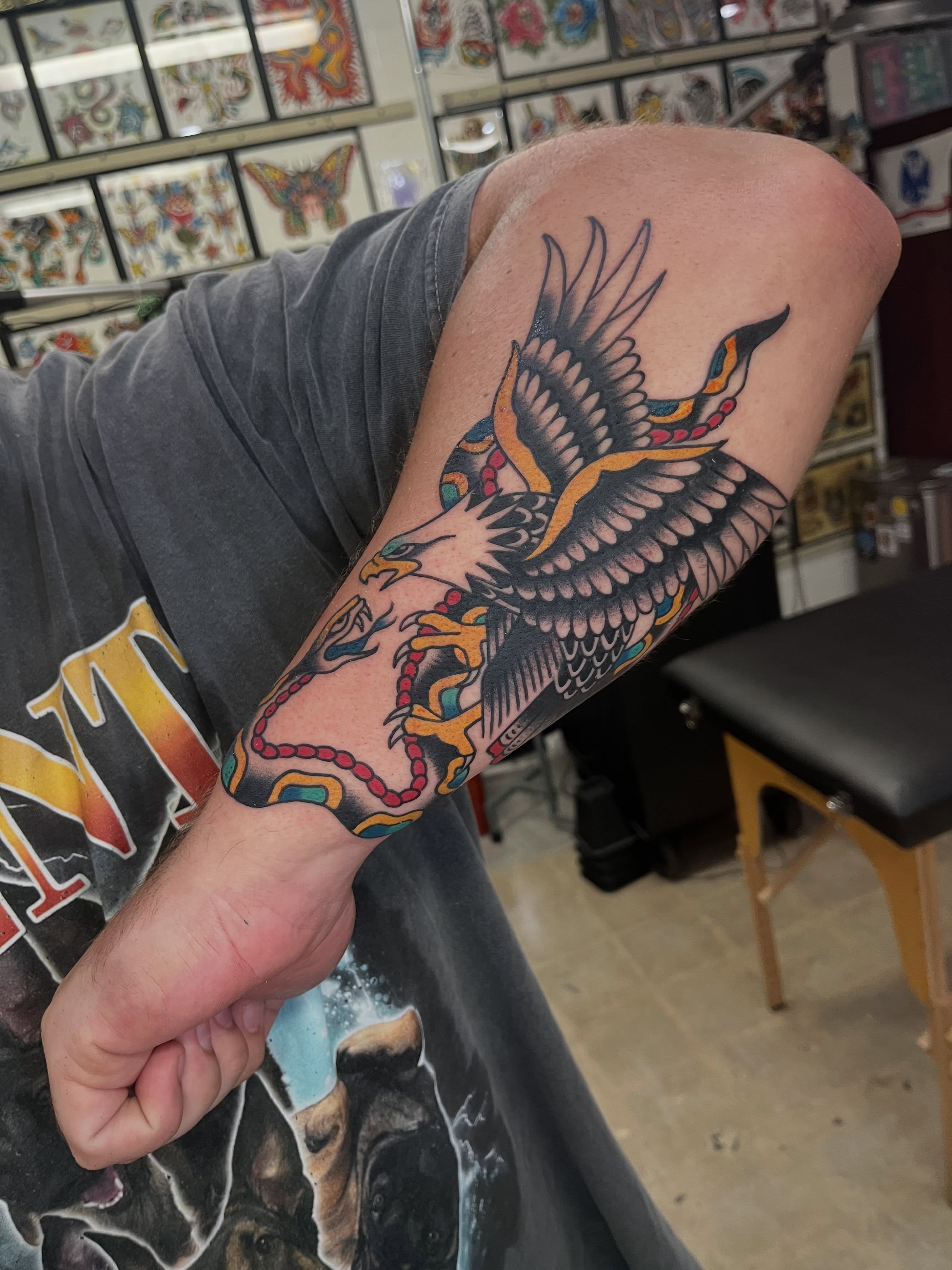 Hawk American traditional tattoo on the forearm by Tim Howell