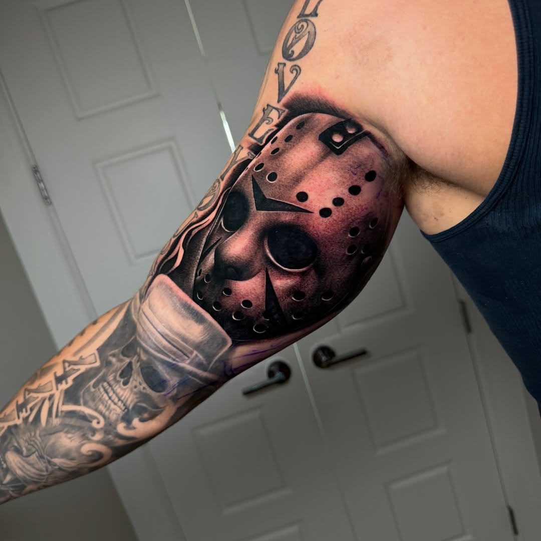Mask realism tattoo on the forearm by Josh Acosta
