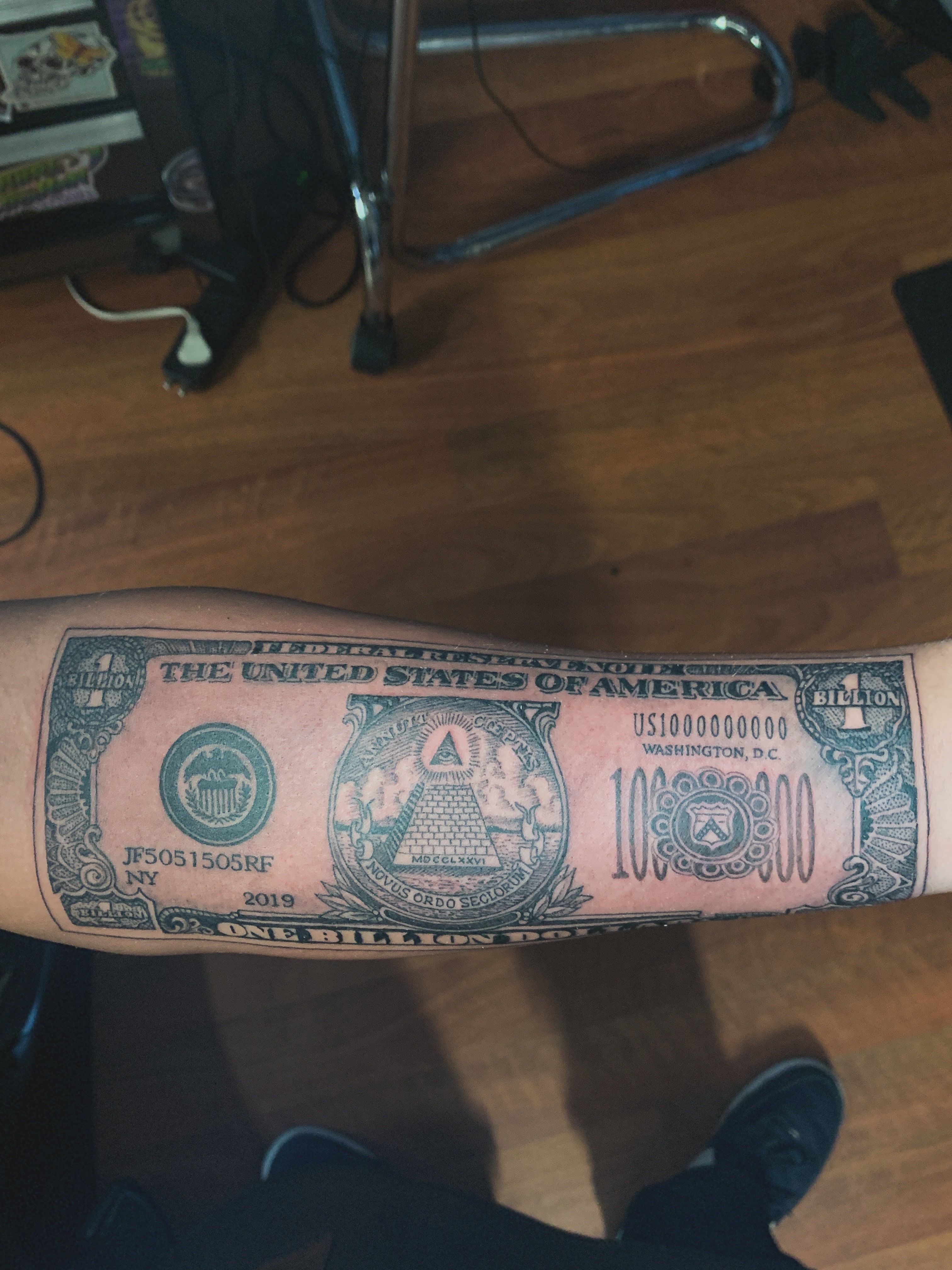 Dollar bill American traditional tattoo on the forearm by Rafael Marte, White Plains, New York