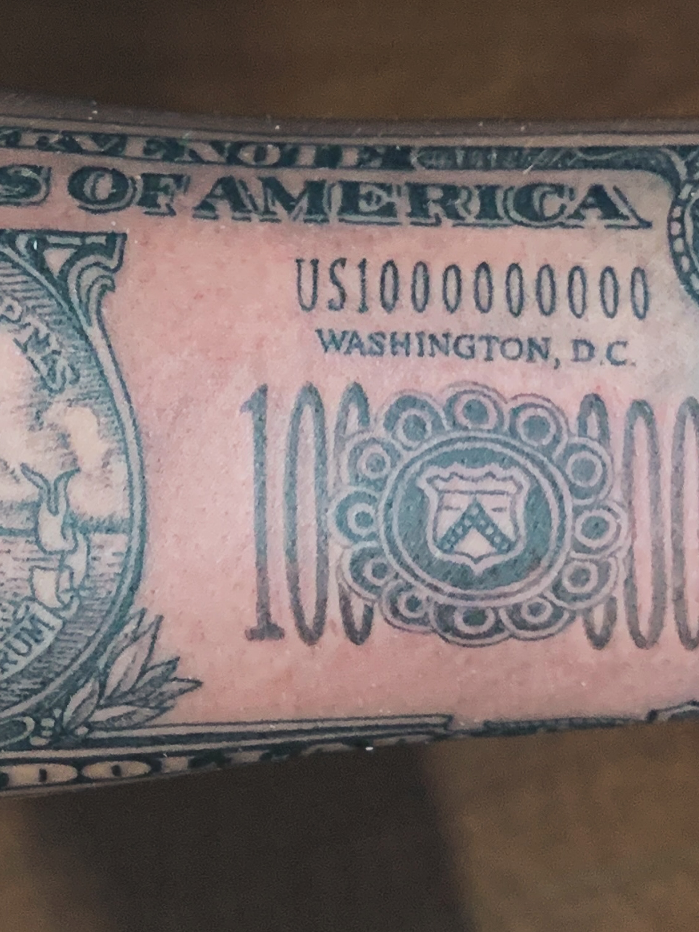 Dollar bill American traditional tattoo on the forearm by Rafael Marte, White Plains, New York