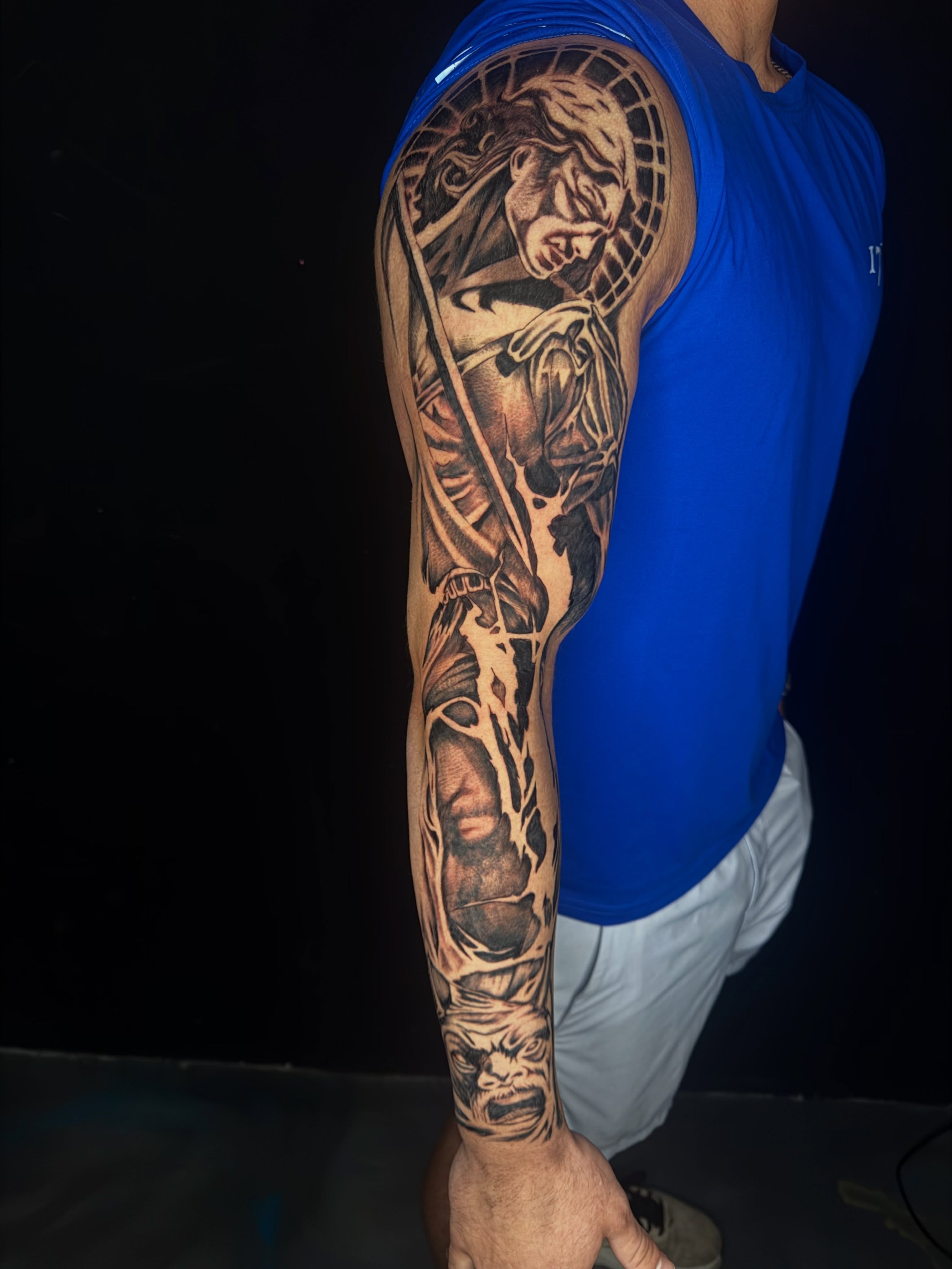 Man with sword realism tattoo on the forearm by David Yancy III