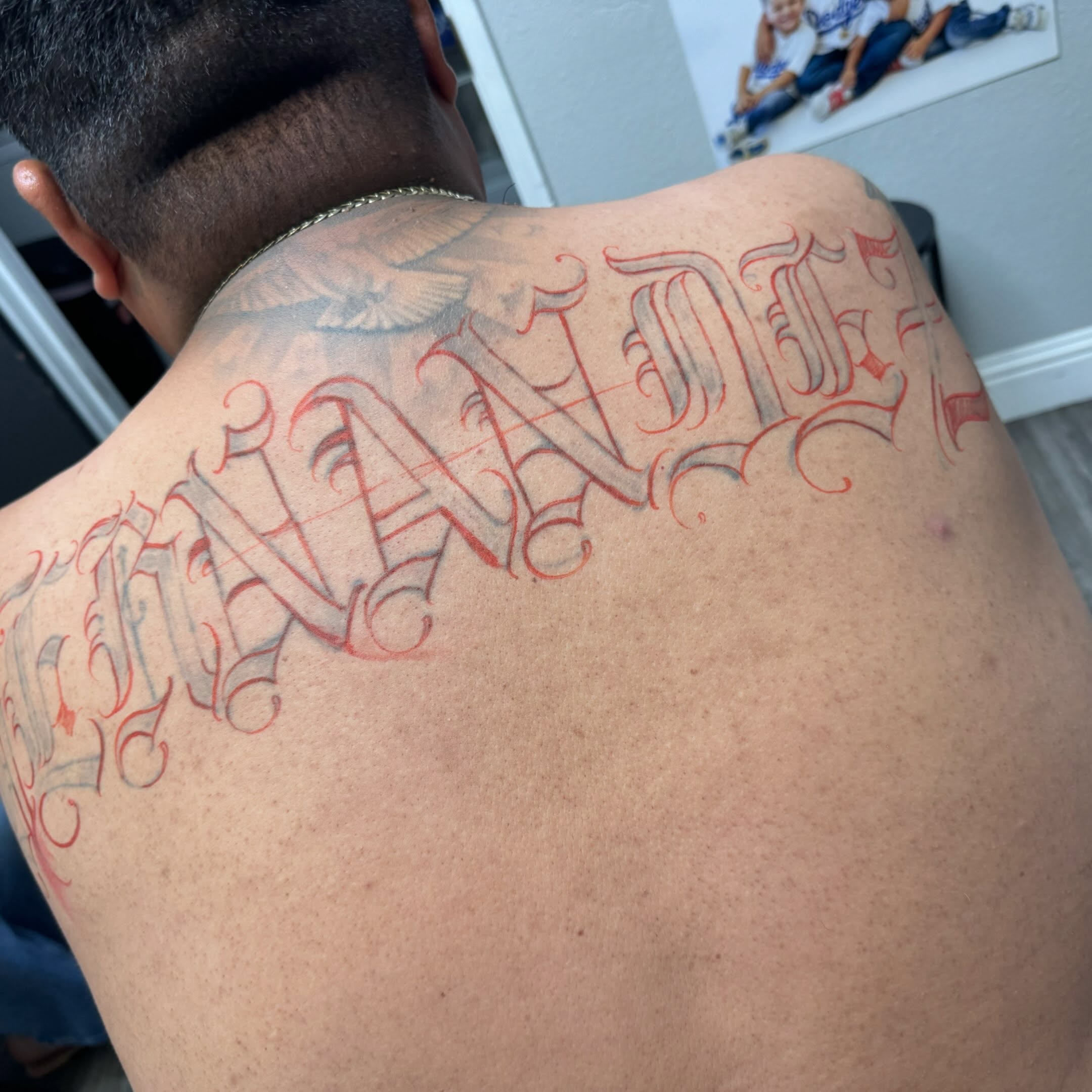 Script lettering lettering script tattoo on the back by El Beaver Tattoos