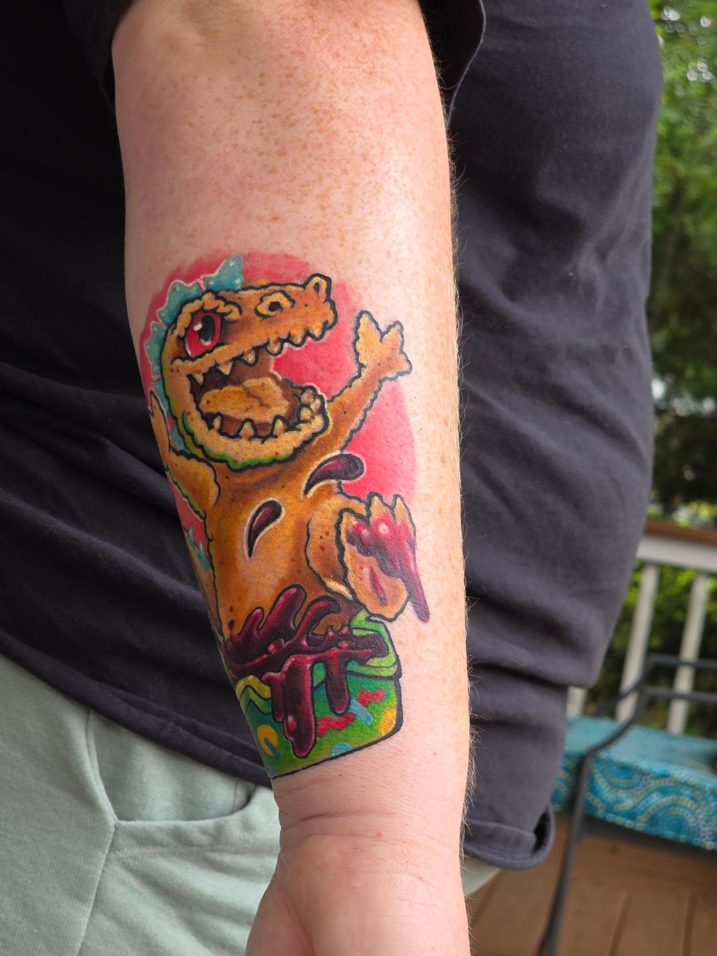 Dinosaur American traditional tattoo on the forearm by Dawne Michele