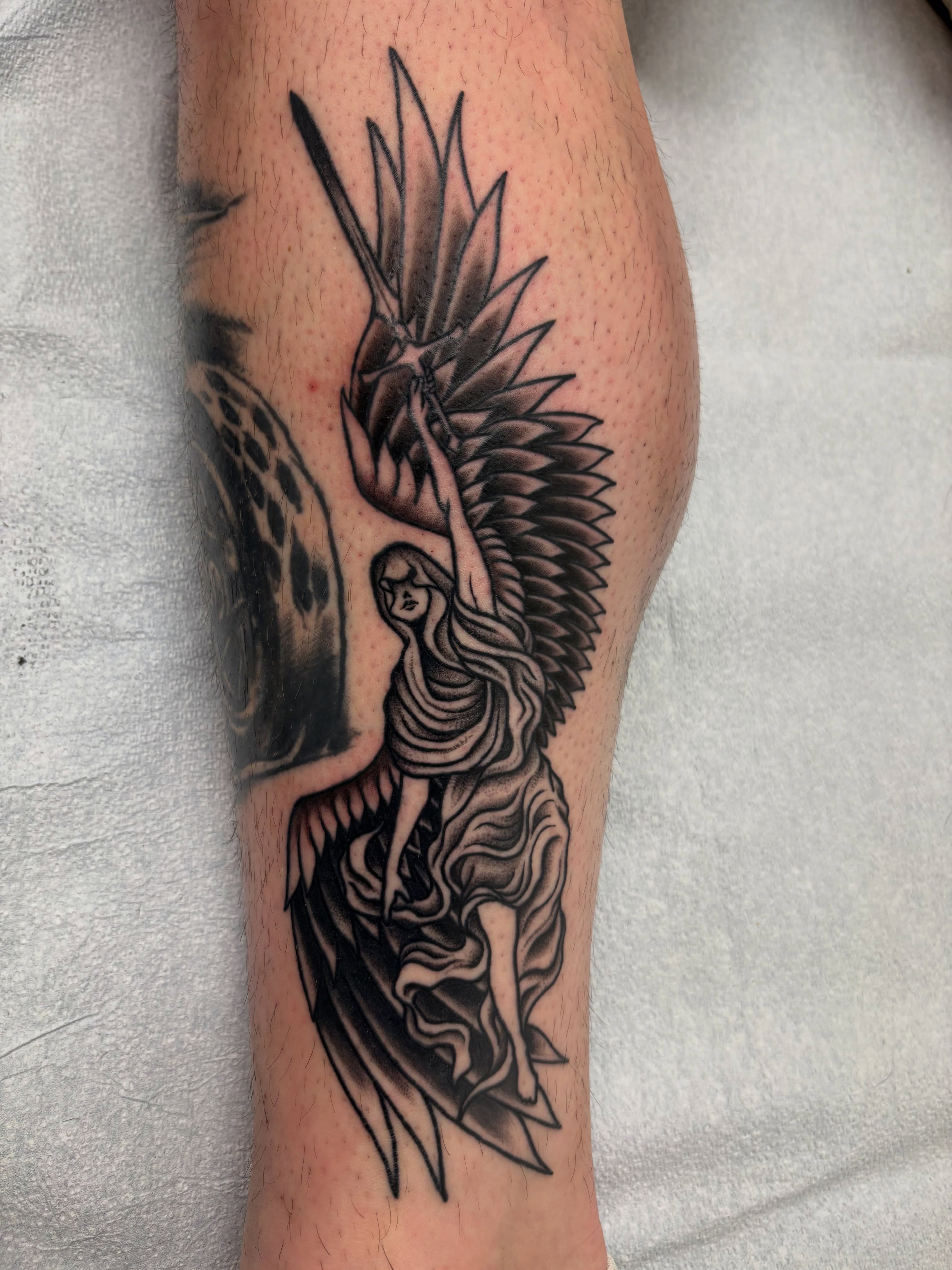 Angel black and grey tattoo on the forearm by Jamie Yuu, Minneapolis, Minnesota