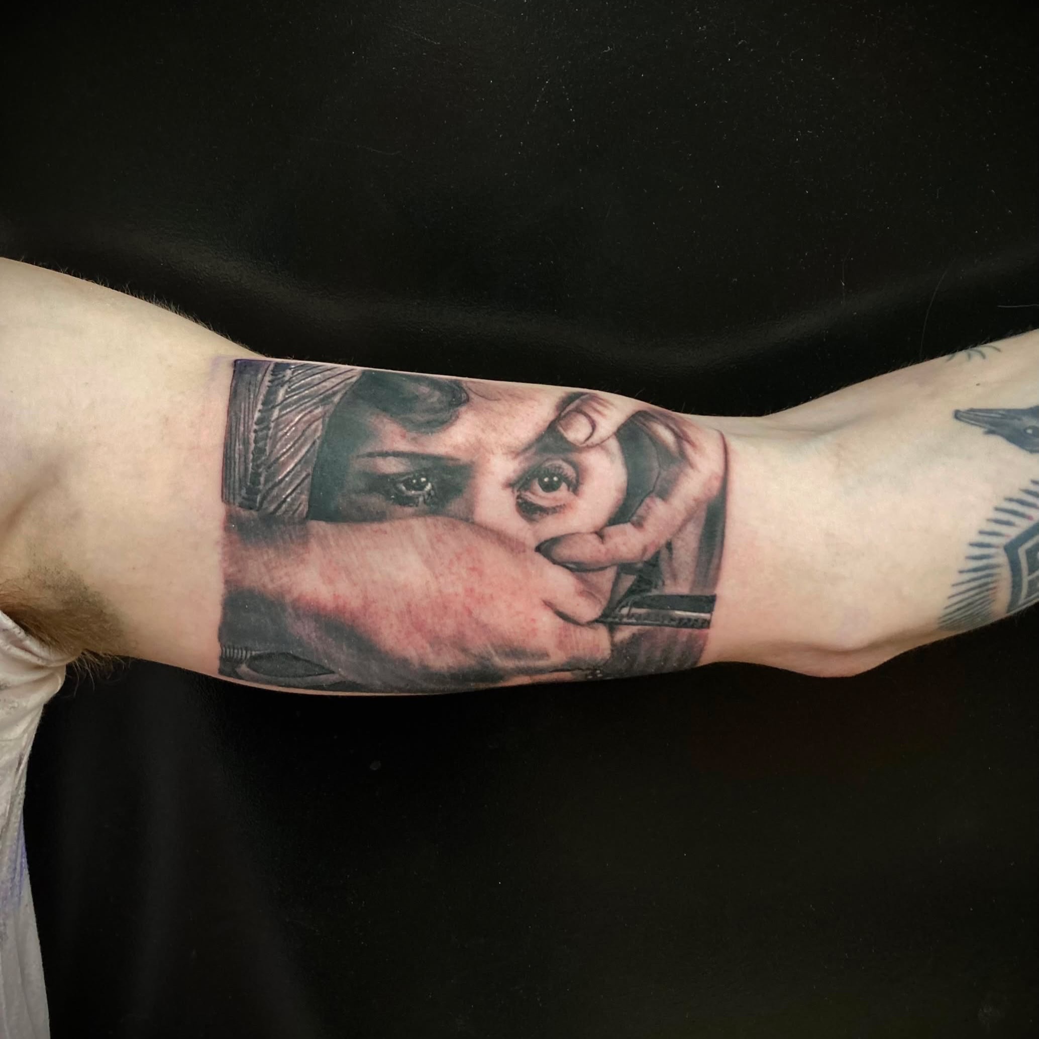 Portrait realism tattoo on the forearm by Bobby Trefz