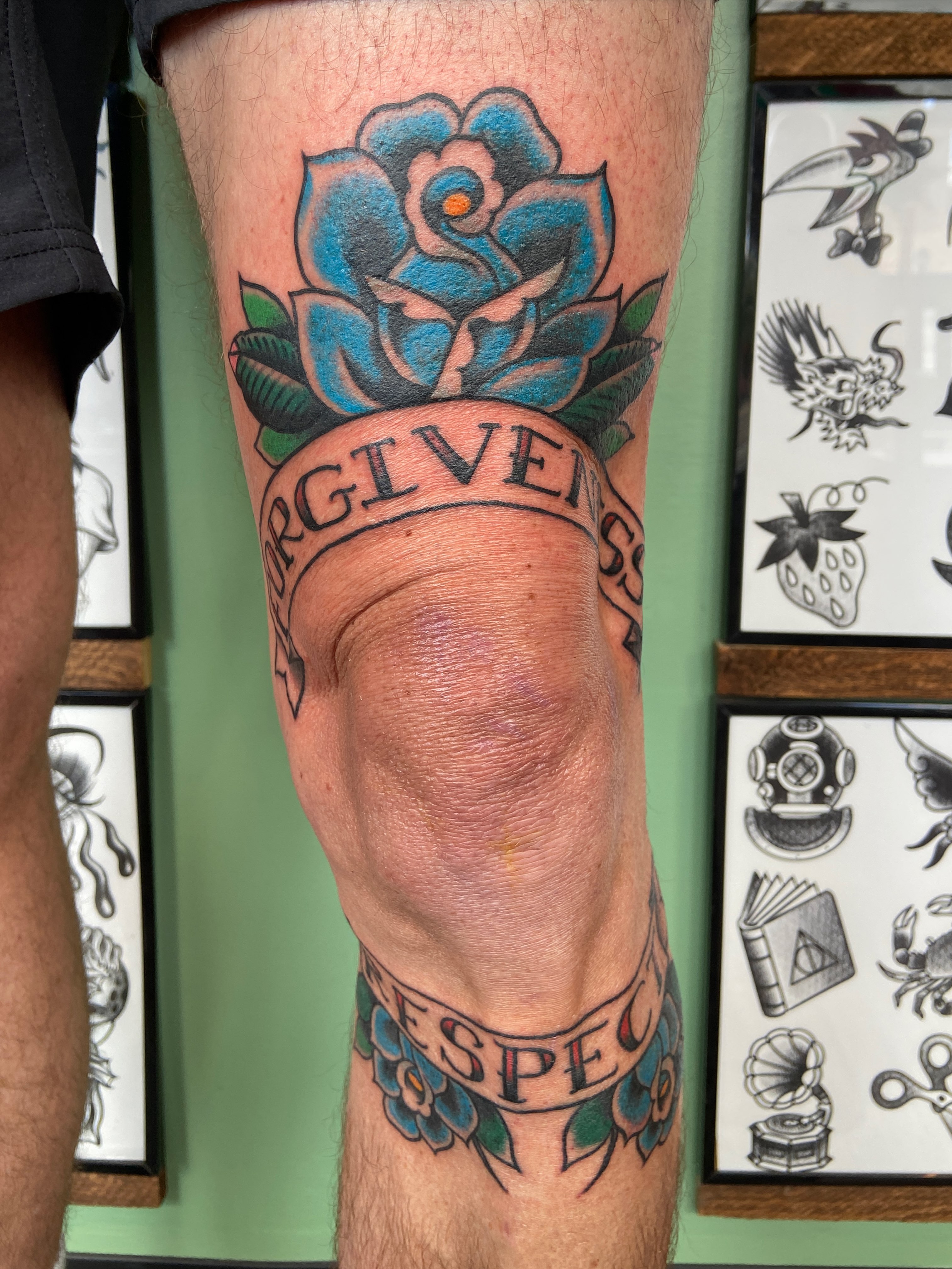 Blue rose with banner American traditional tattoo on the calf by Lucía