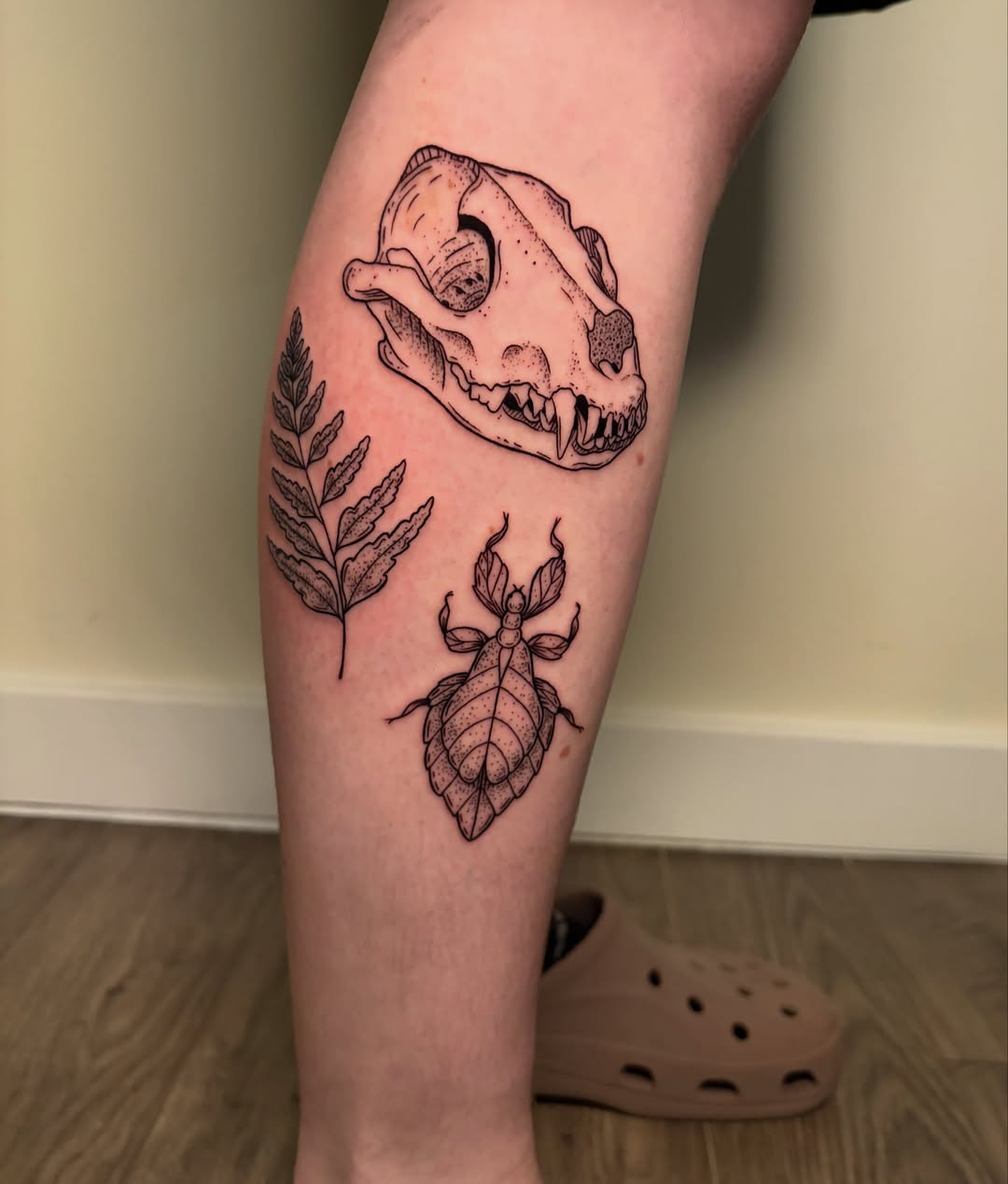 Skull and beetle realism tattoo on the forearm by Ezra Gonda