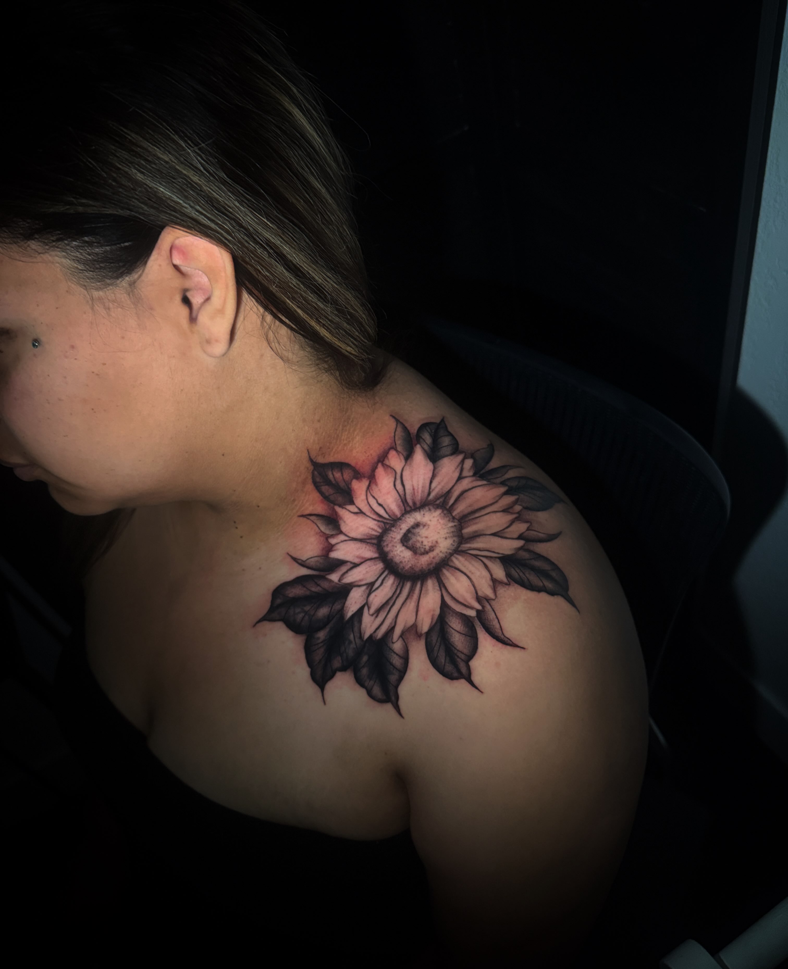 Sunflower realism tattoo on the shoulder by Sad Girl Tattoos