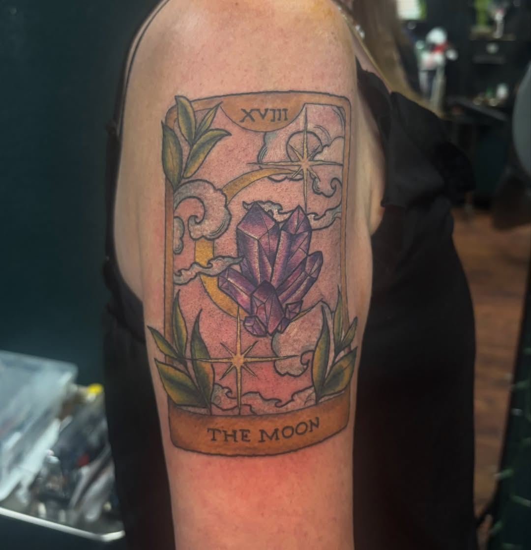 The moon tarot card geometric tattoo on the forearm by Emma ๐