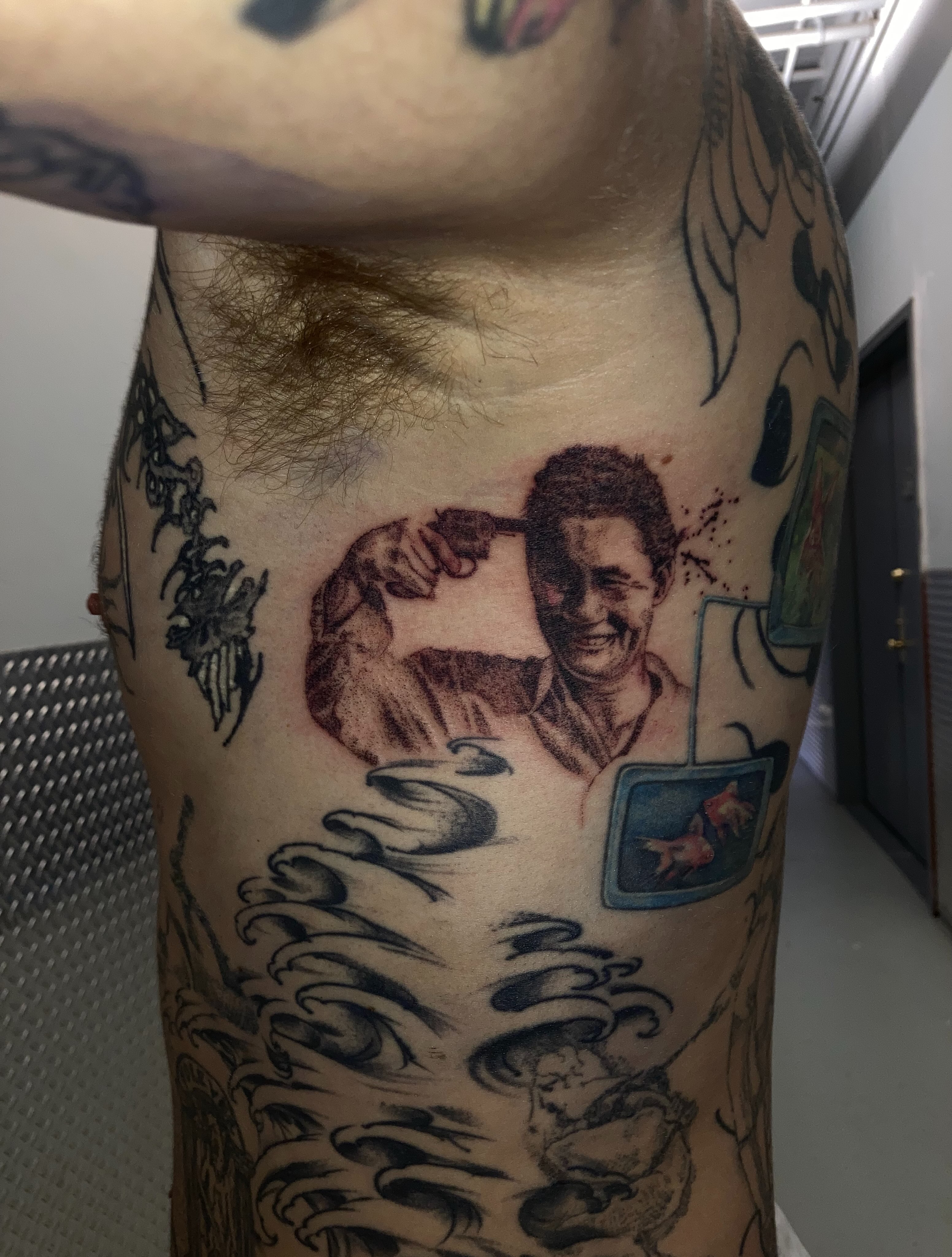 Portrait of man flexing realism tattoo on the chest by Gregory Bramble Tattoo ๐ด๓ ง๓ ข๓ ฅ๓ ฎ๓ ง๓ ฟ