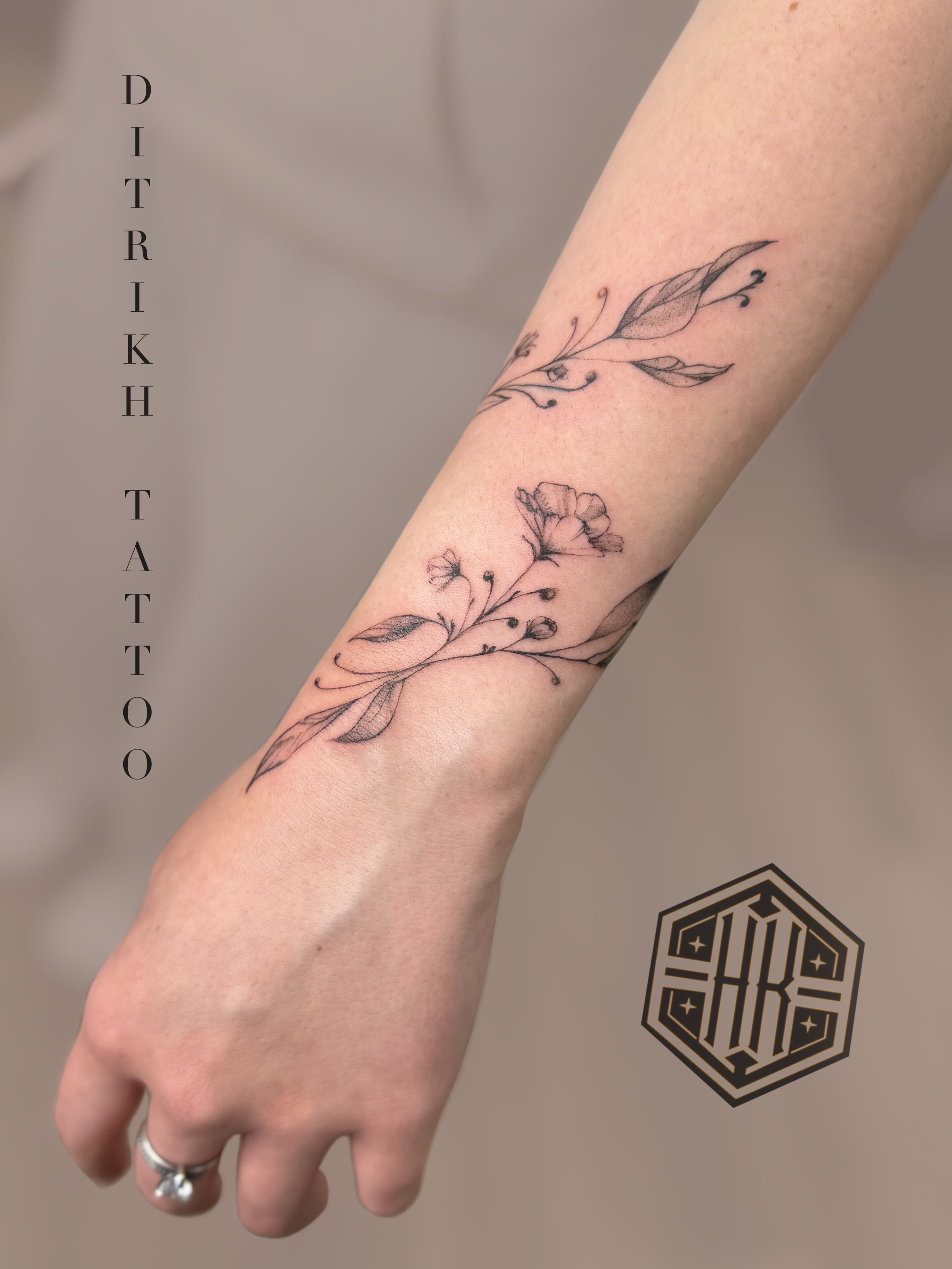 Floral vine black and grey tattoo on the forearm by KET, Calgary, Alberta
