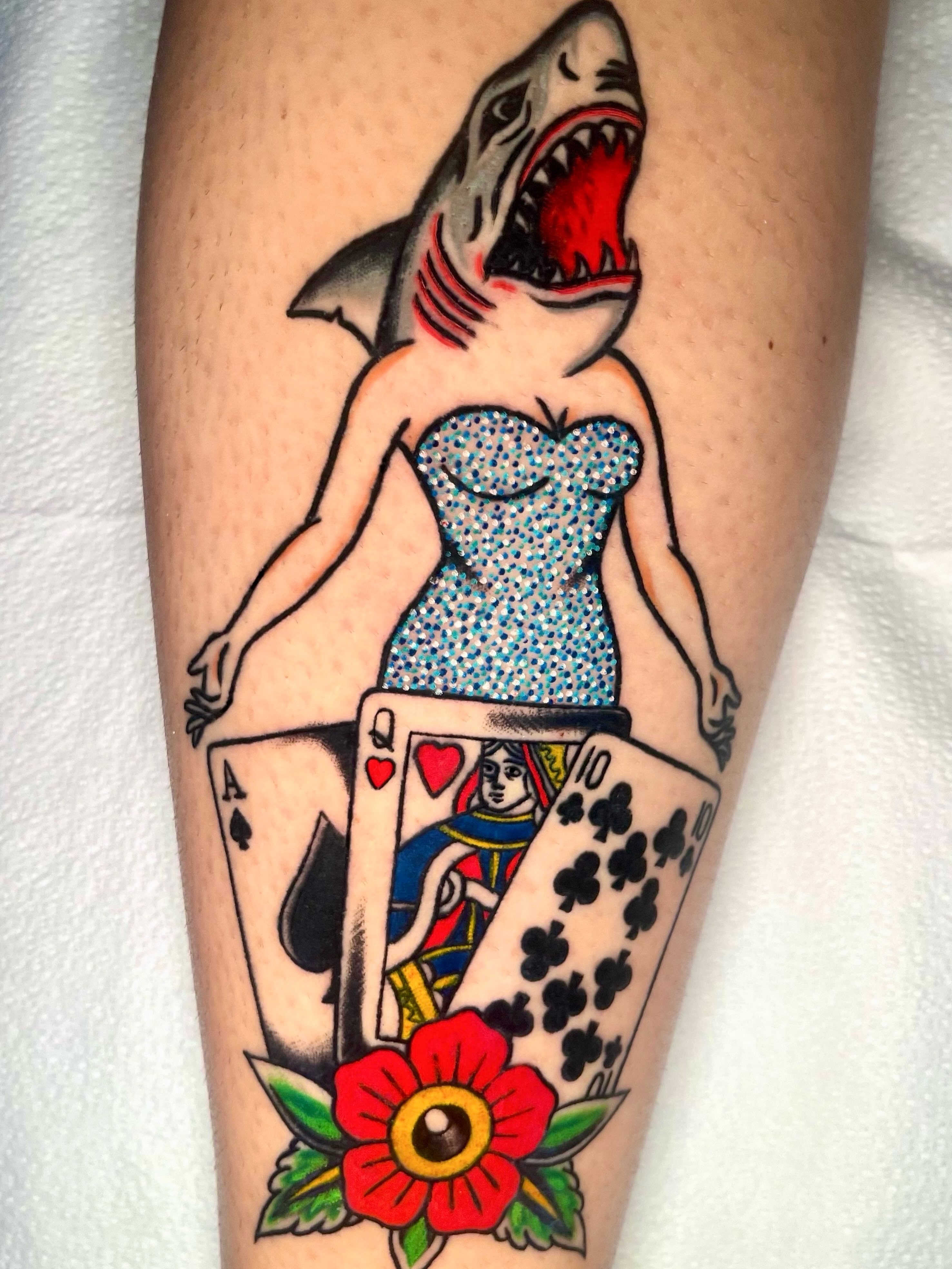 Shark woman with playing cards American traditional tattoo on the leg by Brooke Kresco
