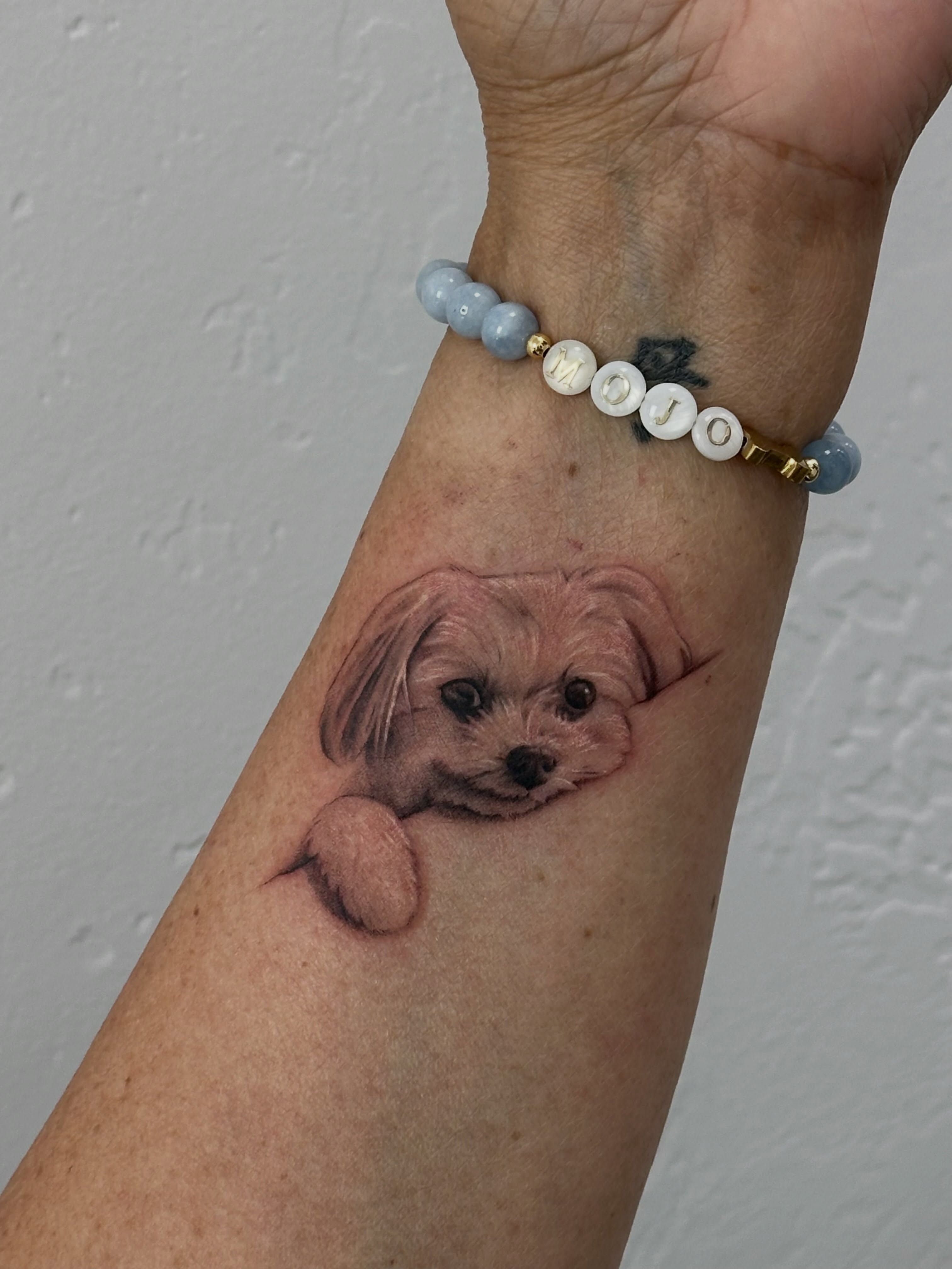 Dog realism tattoo on the forearm by Winters Ashurst - St. George tattoo artist