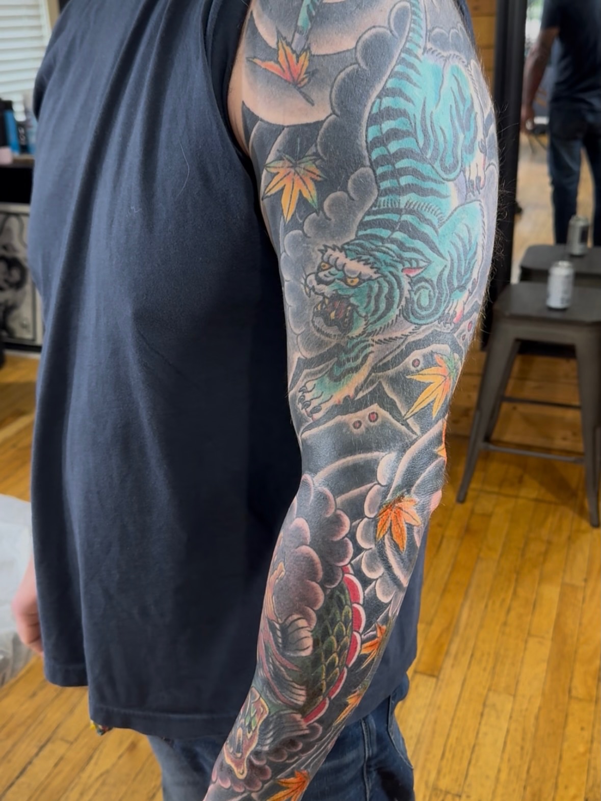 Tiger and maple leaves japanese irezumi tattoo on the upper arm by Eric James, Columbus, Ohio