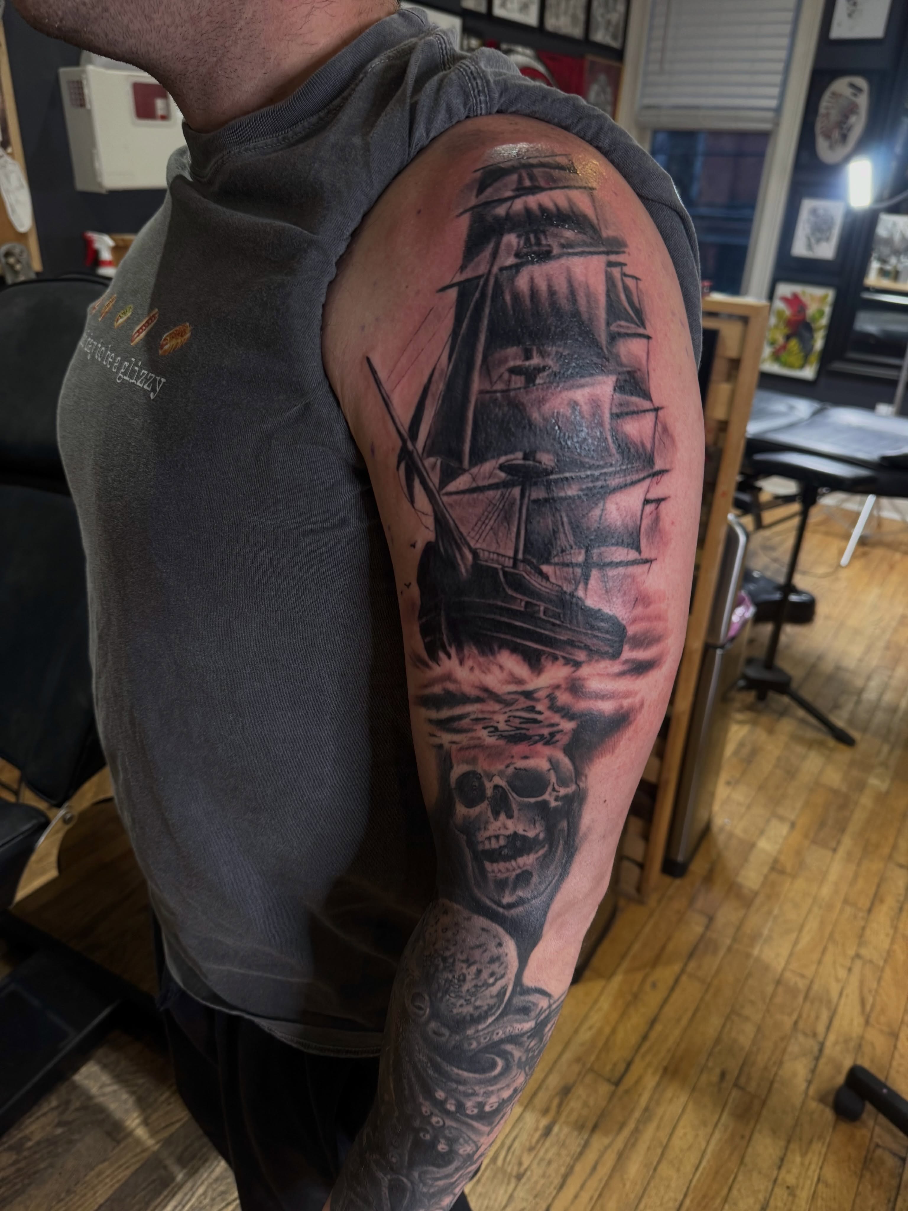 Ship and skull realism tattoo on the upper arm by Eric James, Columbus, Ohio