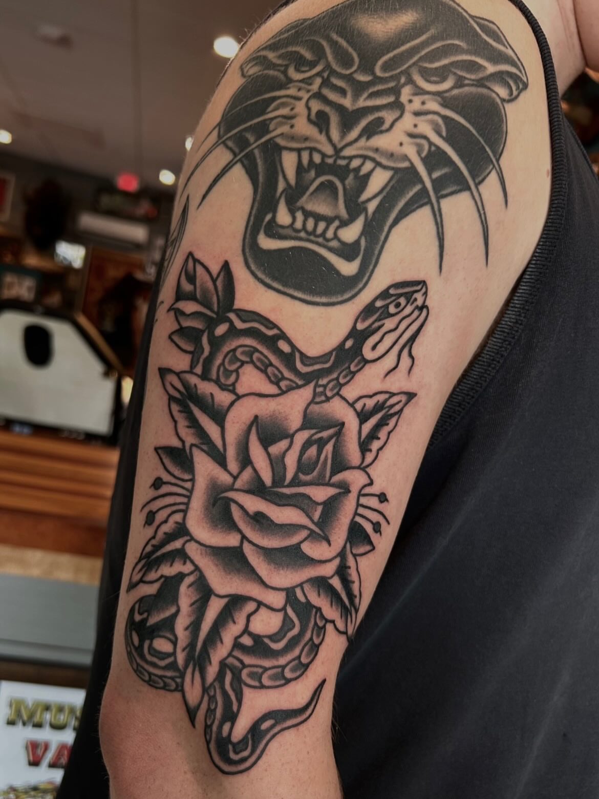 Panther and snake American traditional tattoo on the forearm by Morgan Mansfield