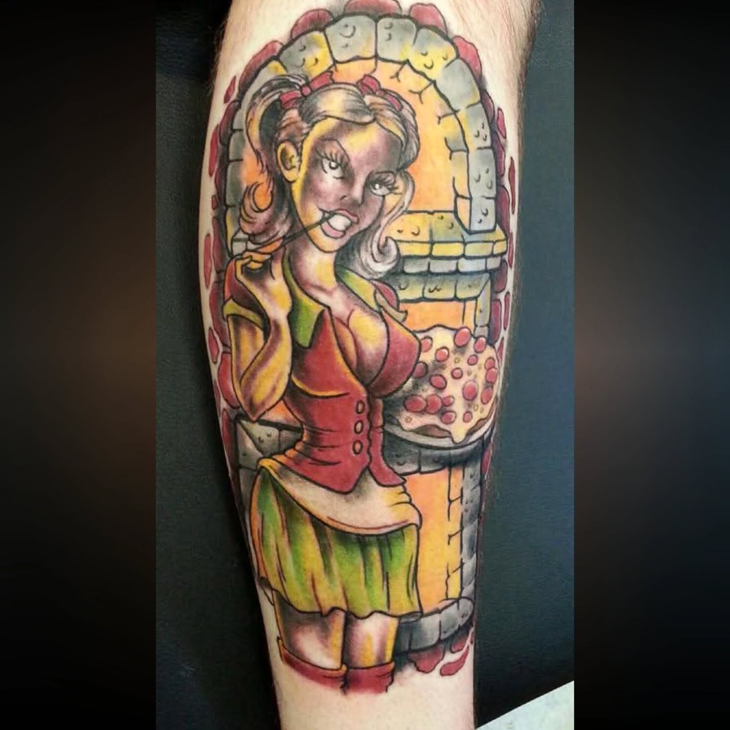 Woman with pizza illustrative tattoo on the forearm by Shane Watkins
