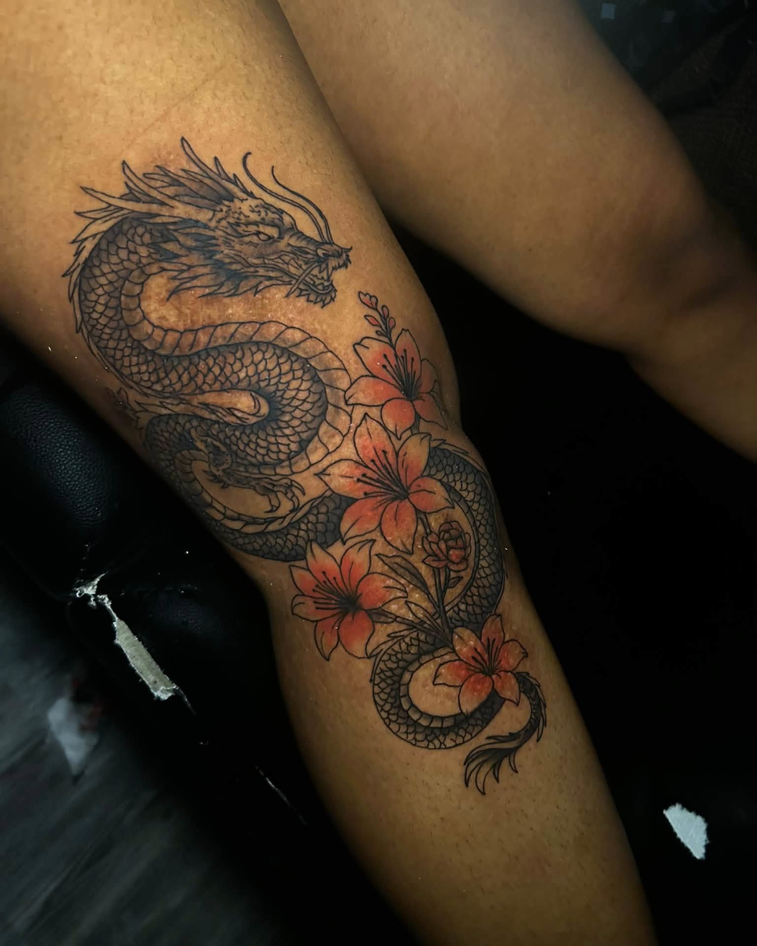 Dragon and flowers japanese irezumi tattoo on the thigh by Ferlandis Fitch, Long Beach, California