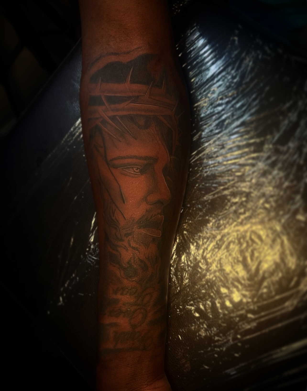 Religious figure realism tattoo on the forearm by @tattsbyleek