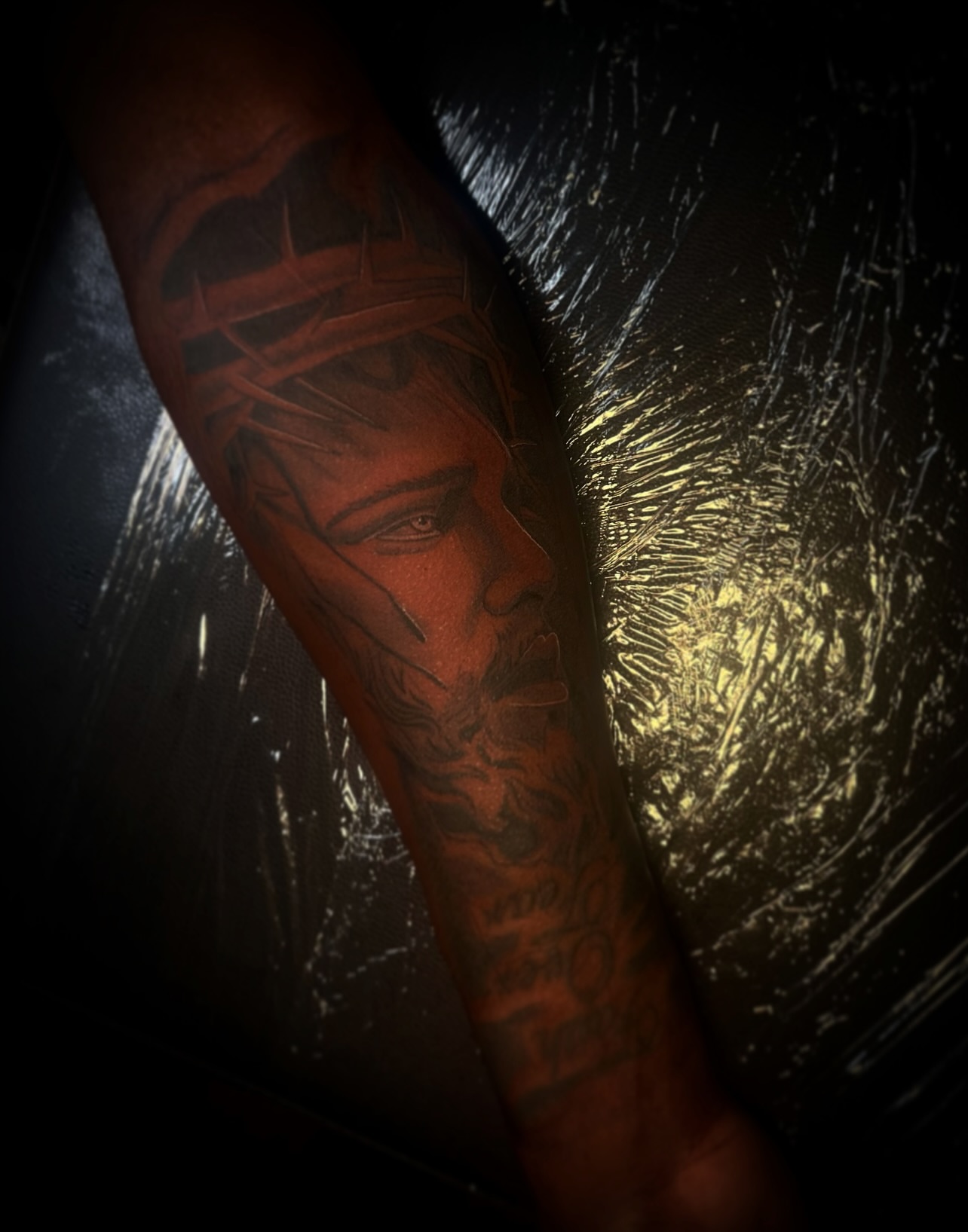 Religious figure black and grey tattoo on the forearm by @tattsbyleek