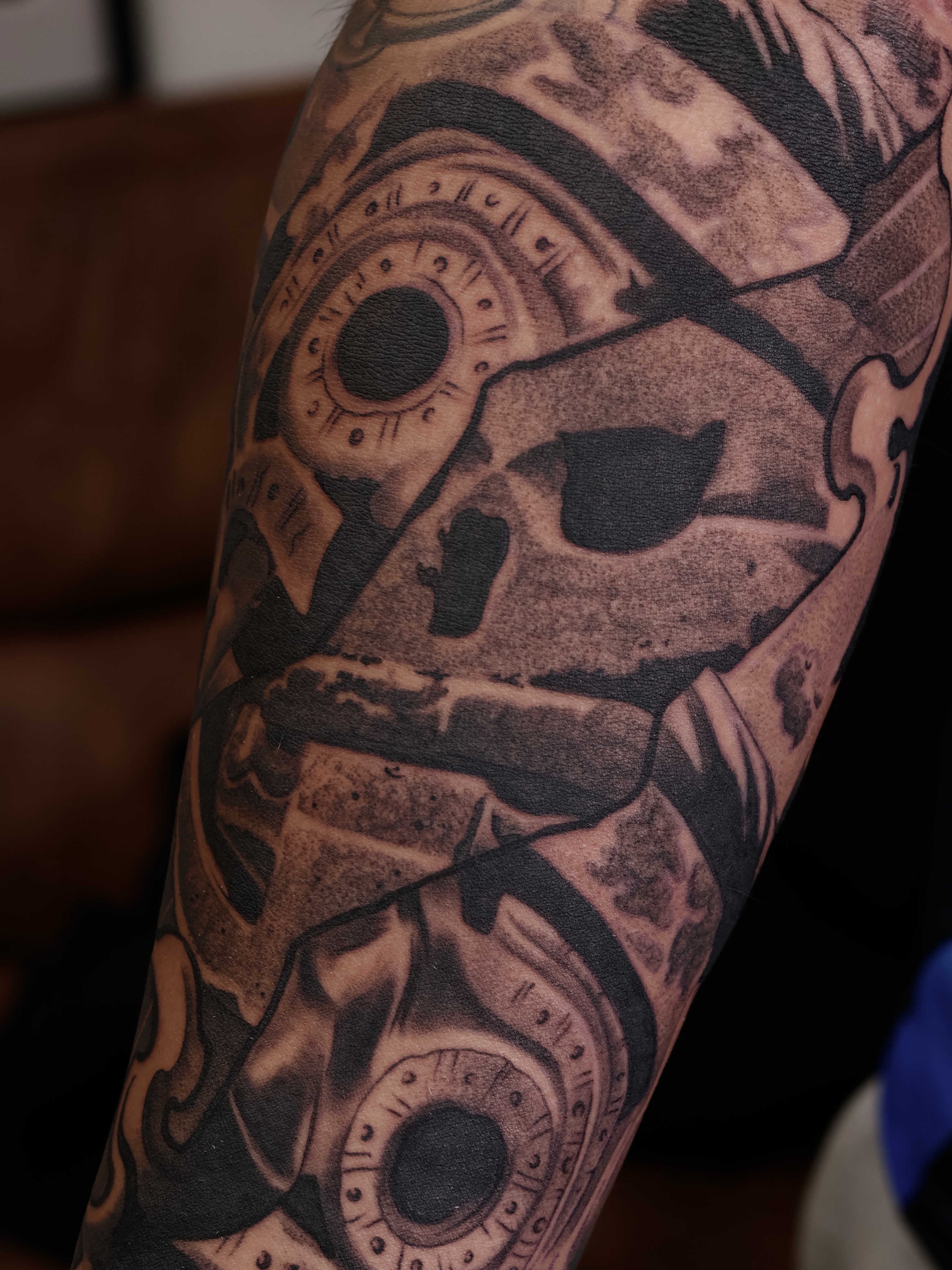 Mechanical skull realism tattoo on the forearm by San Diego Tattoo Artist