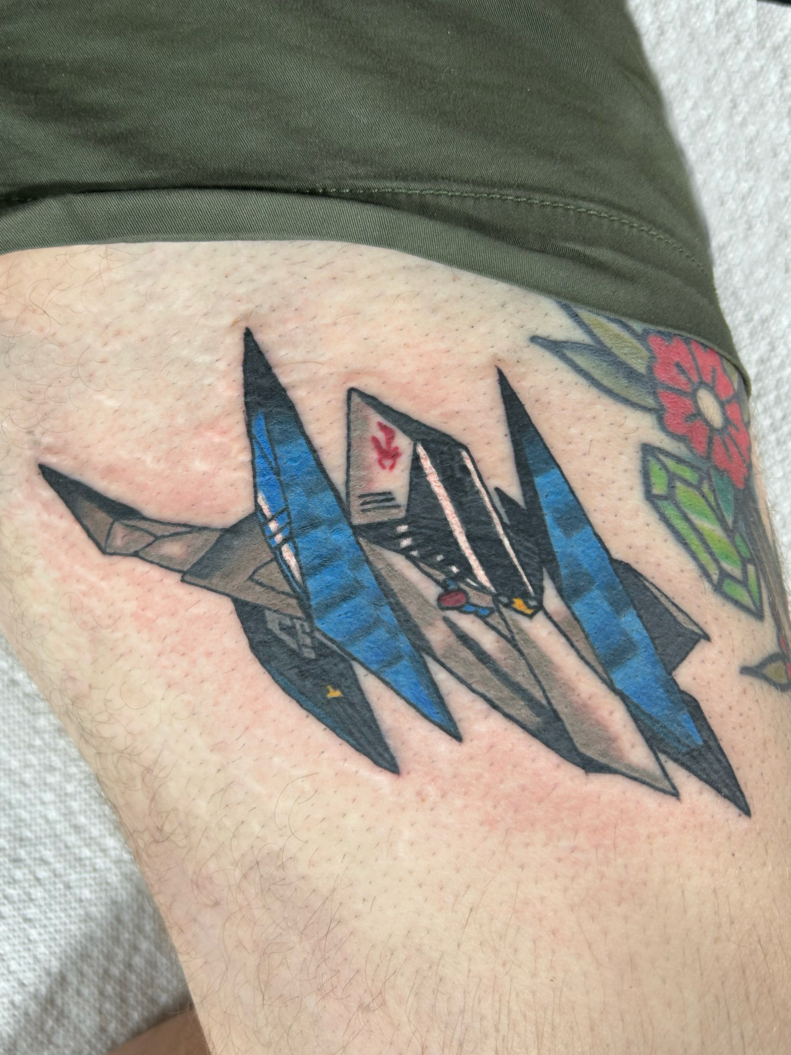 Fighter jets geometric tattoo on the thigh by Ollie