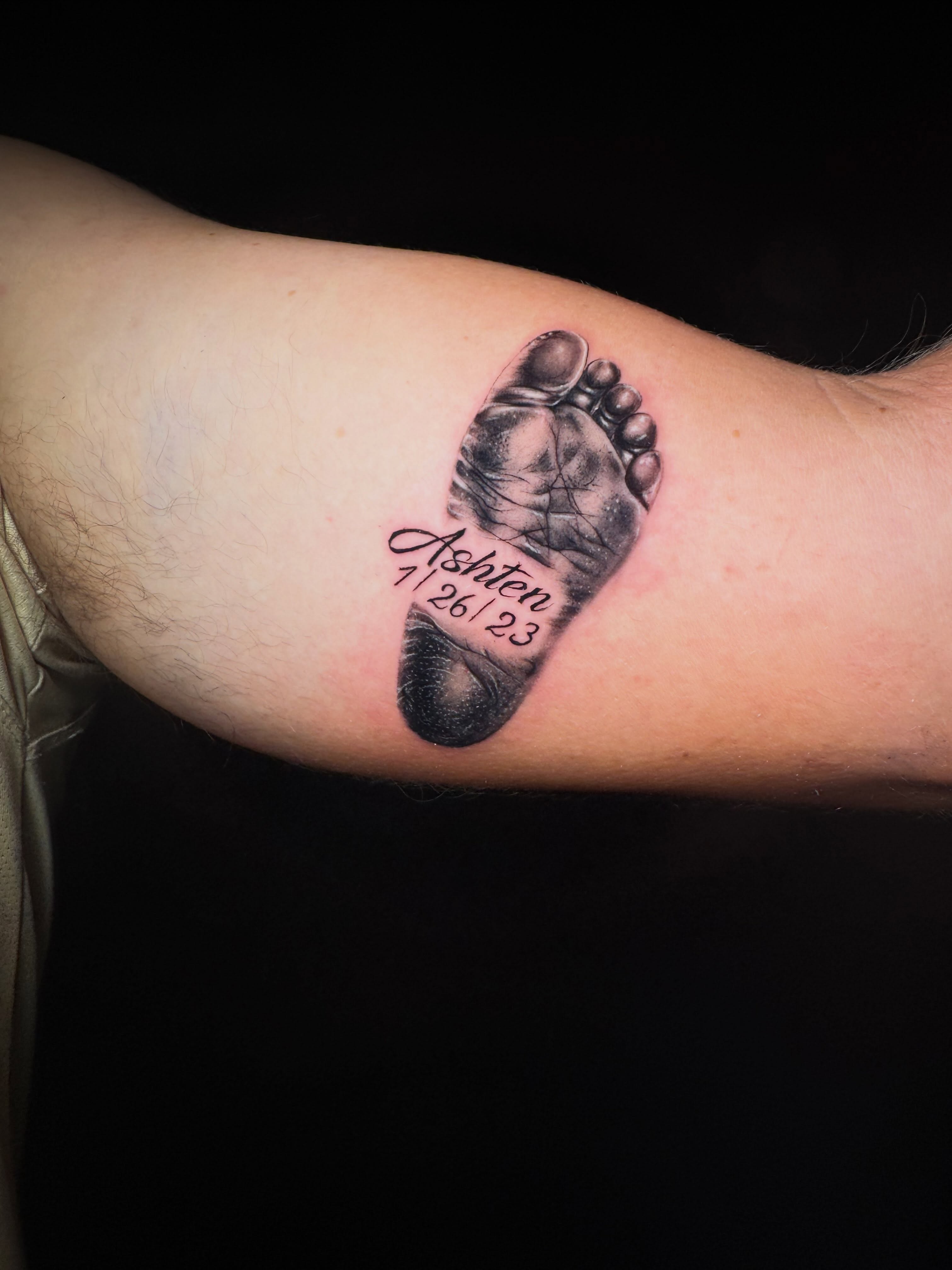 Baby footprint realism tattoo on the forearm by Jewels, St. George, Utah
