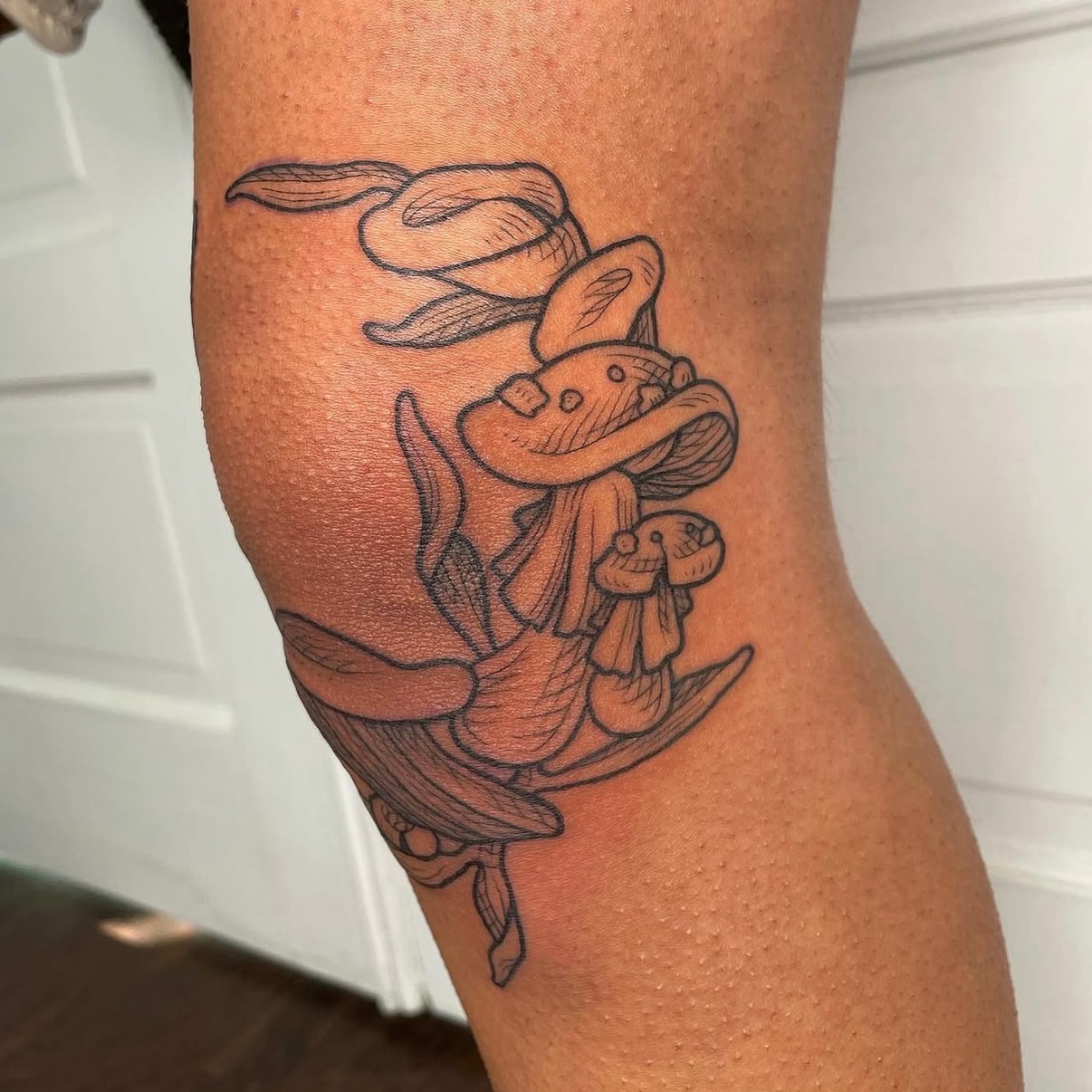 Snake and mushroom black and grey tattoo on the thigh by Taylor 🍂☕️