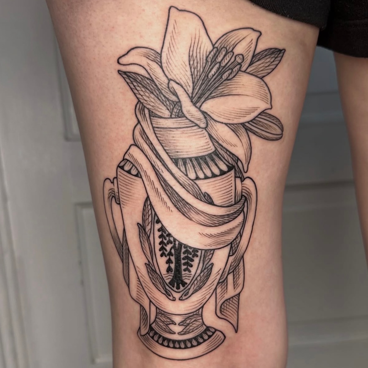Lily and anatomical structure realism tattoo on the thigh by Taylor 🍂☕️