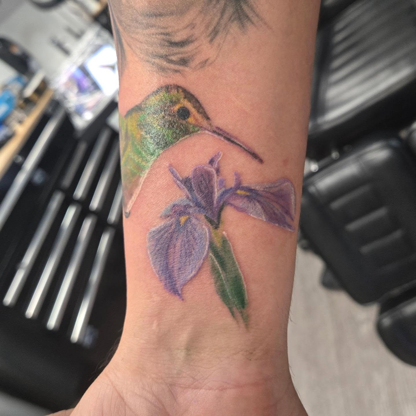 Hummingbird and iris realism tattoo on the forearm by Jose G. Rubio Tattoo Artist πΊπ²ππ¨π¦