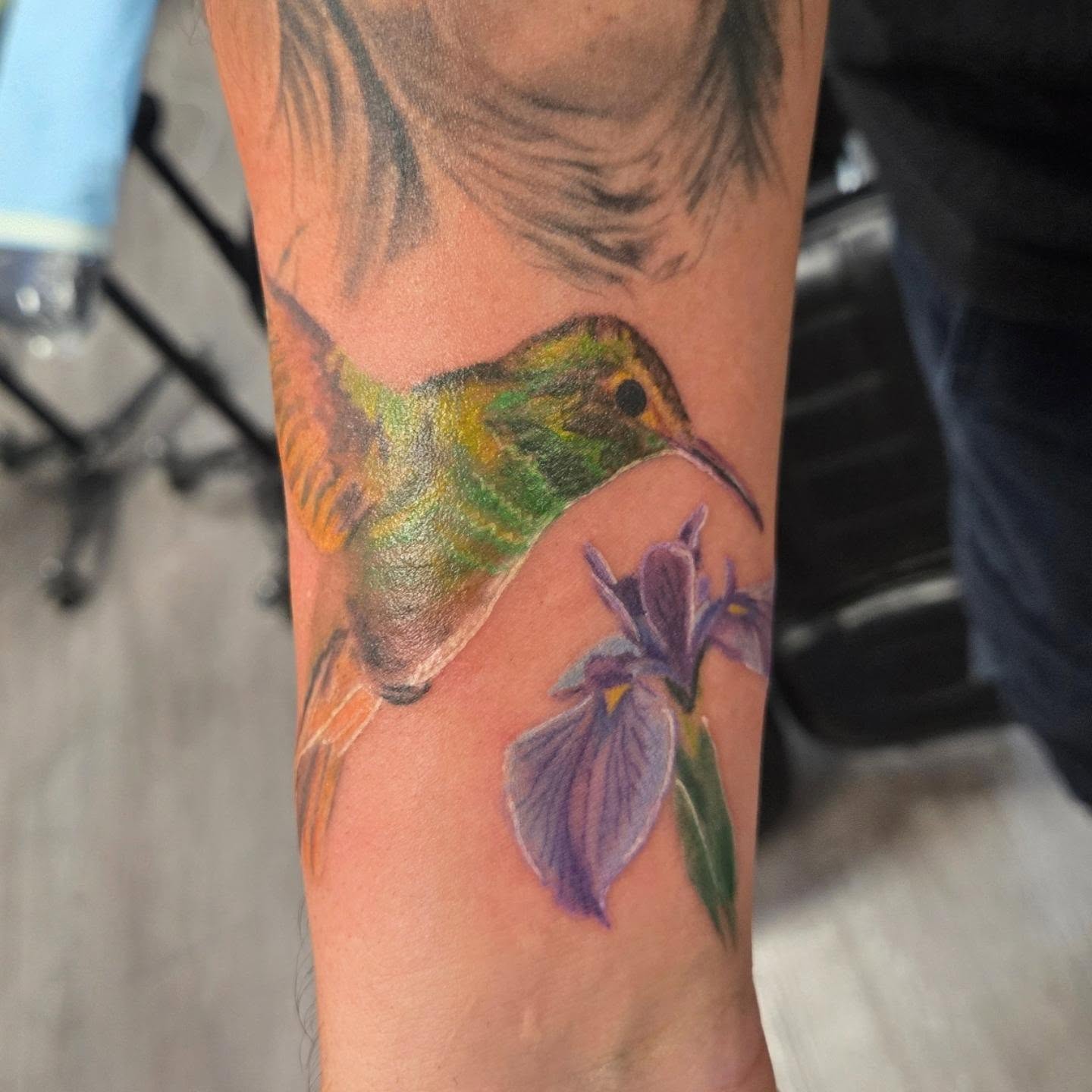 Hummingbird and iris realism tattoo on the forearm by Jose G. Rubio Tattoo Artist πΊπ²ππ¨π¦