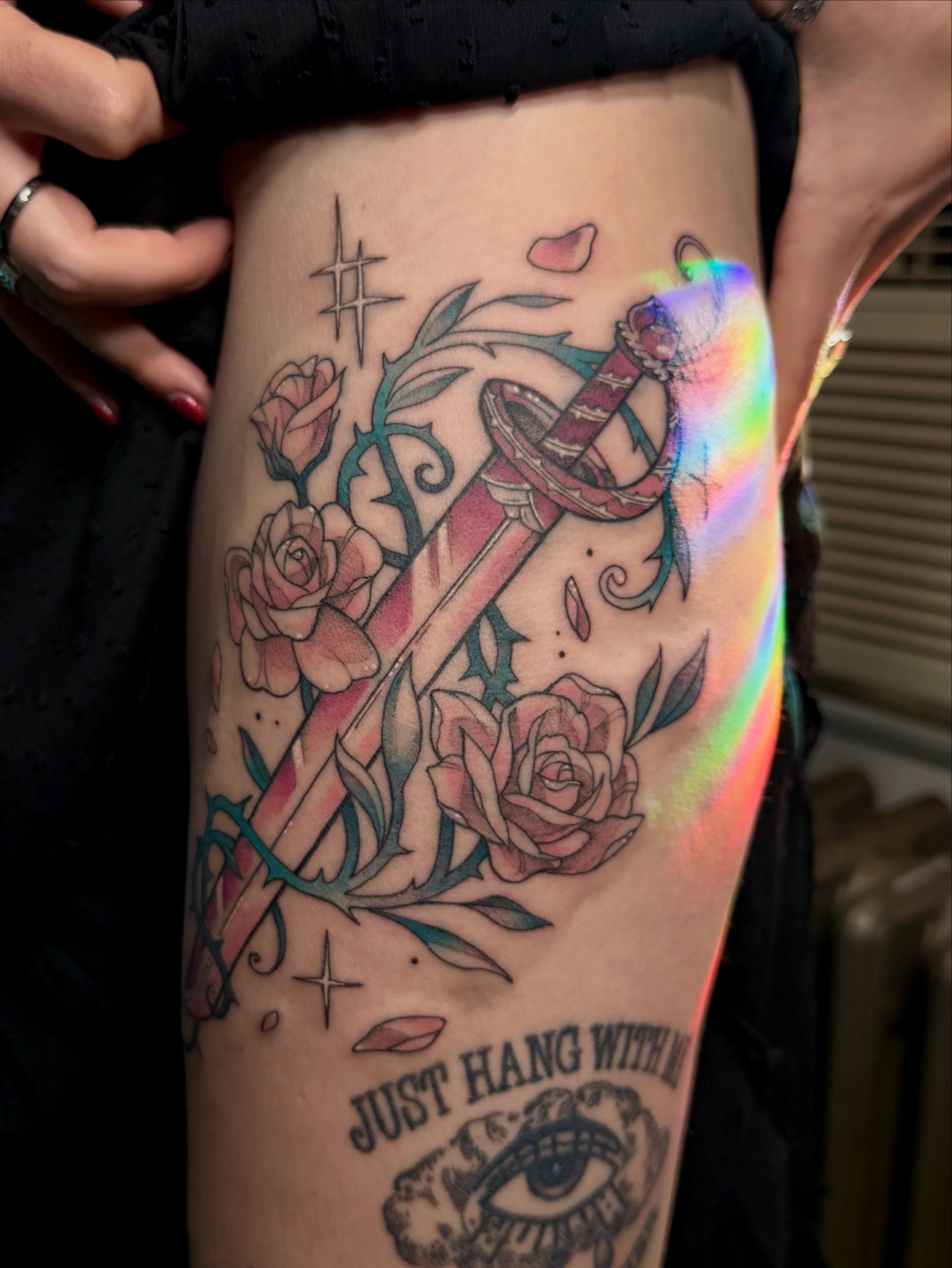 Roses and sword American traditional tattoo on the thigh by Jynx
