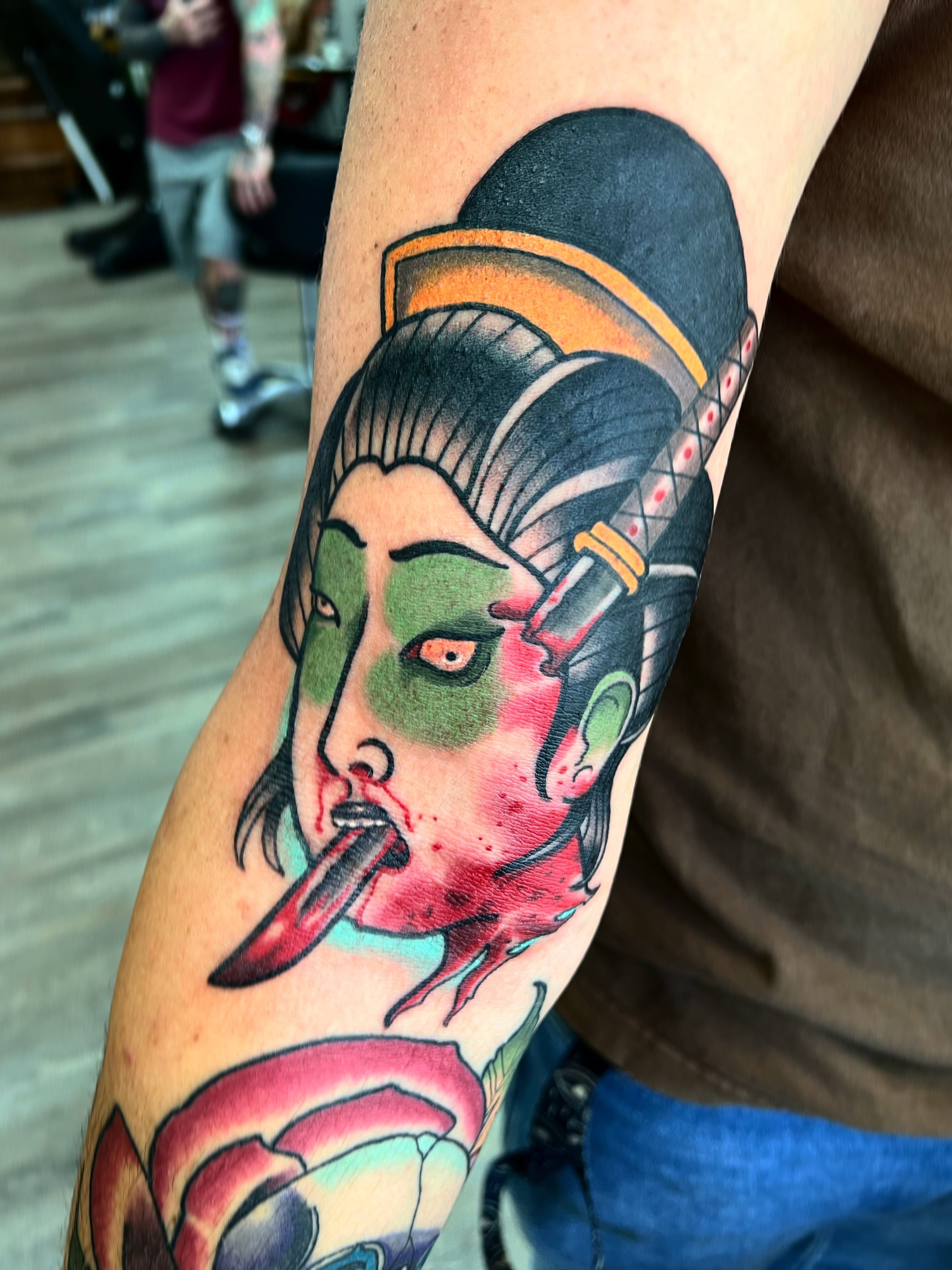 Geisha American traditional tattoo on the forearm by Brandon McDaniel Iowa Tattoo Artist