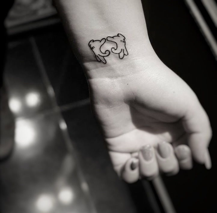 Cat minimalist tattoo on the foot by Yana Aizen