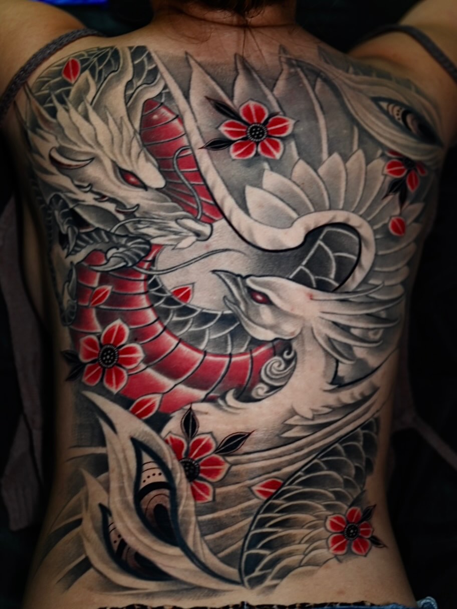 Dragon and phoenix japanese irezumi tattoo on the back by Tam Nguyen