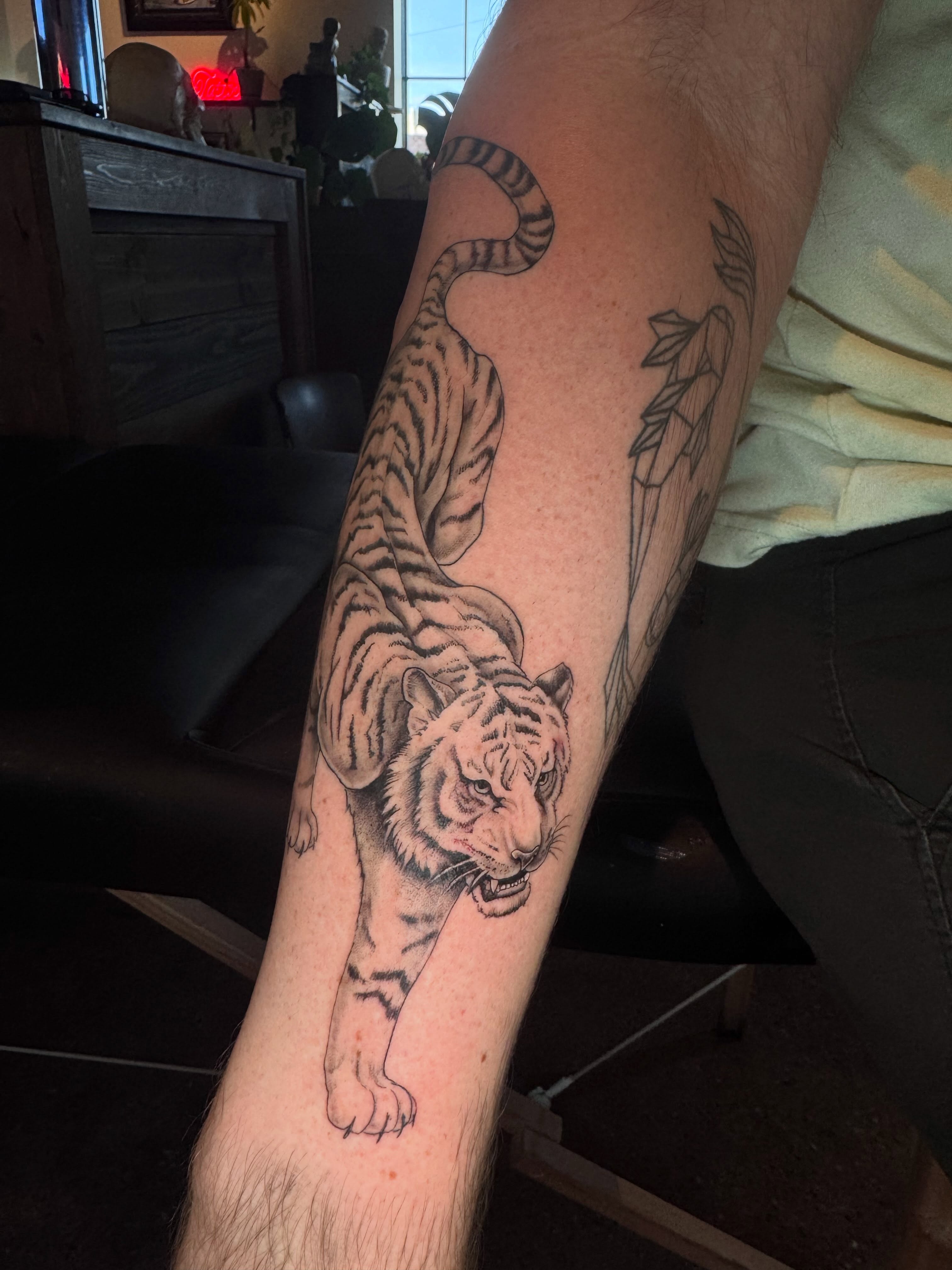 Tiger realism tattoo on the forearm by Gabrielle Mack