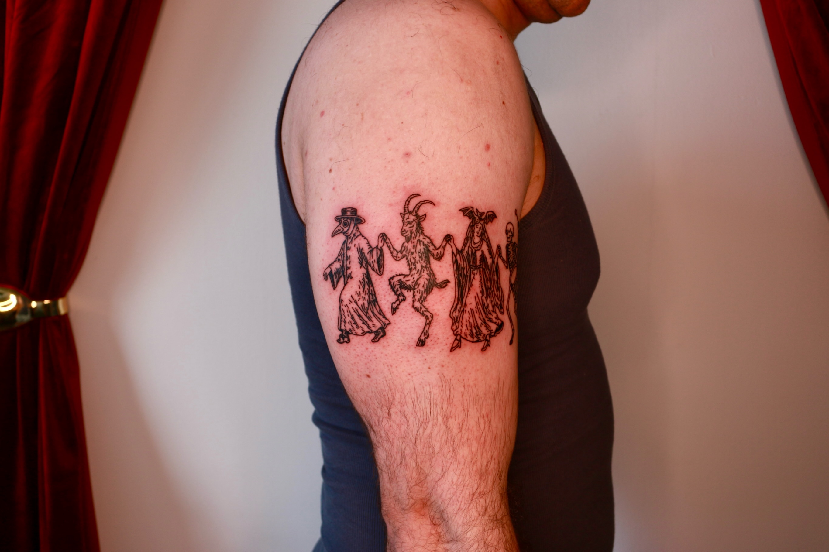 Plague doctor, goat, woman, man black and grey tattoo on the forearm by Mike