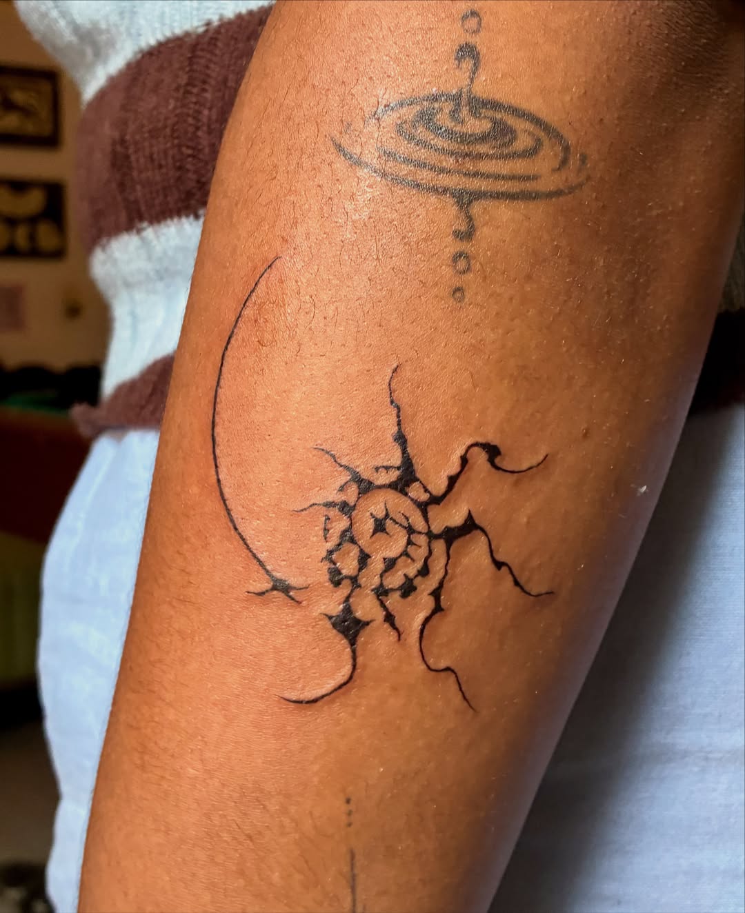 Abstract design geometric tattoo on the forearm by thalia