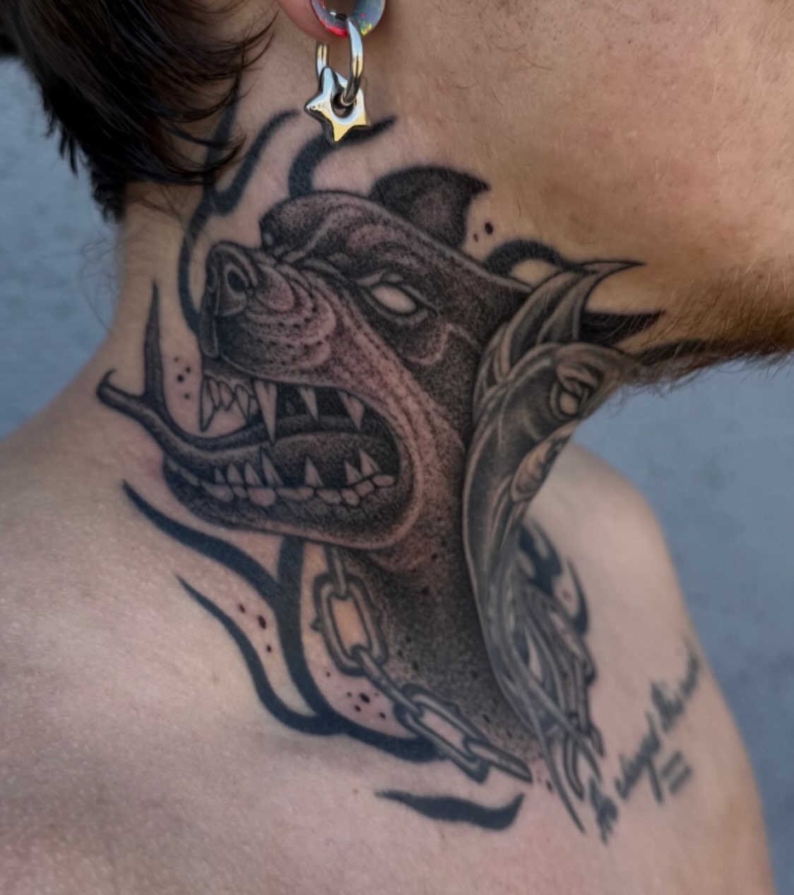 Angry dog realism tattoo on the neck by Austin Tattoo Artist