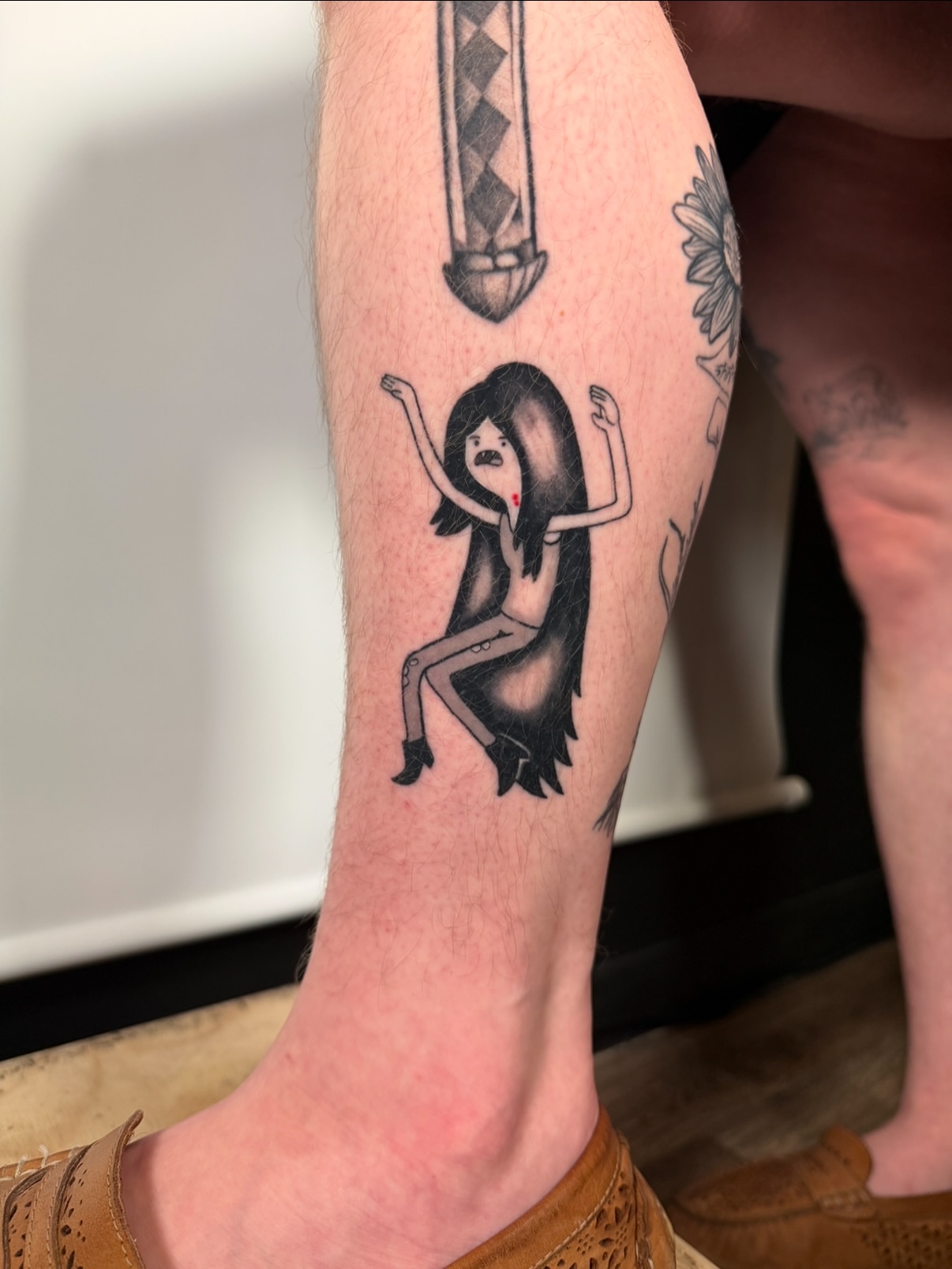 Woman with mustache black and grey tattoo on the forearm by aria, Austin, Texas