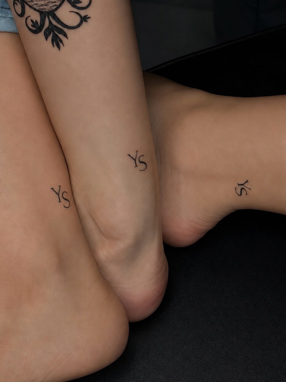 Initials black and grey tattoo on the foot by Exis LHinc, Miami, Florida