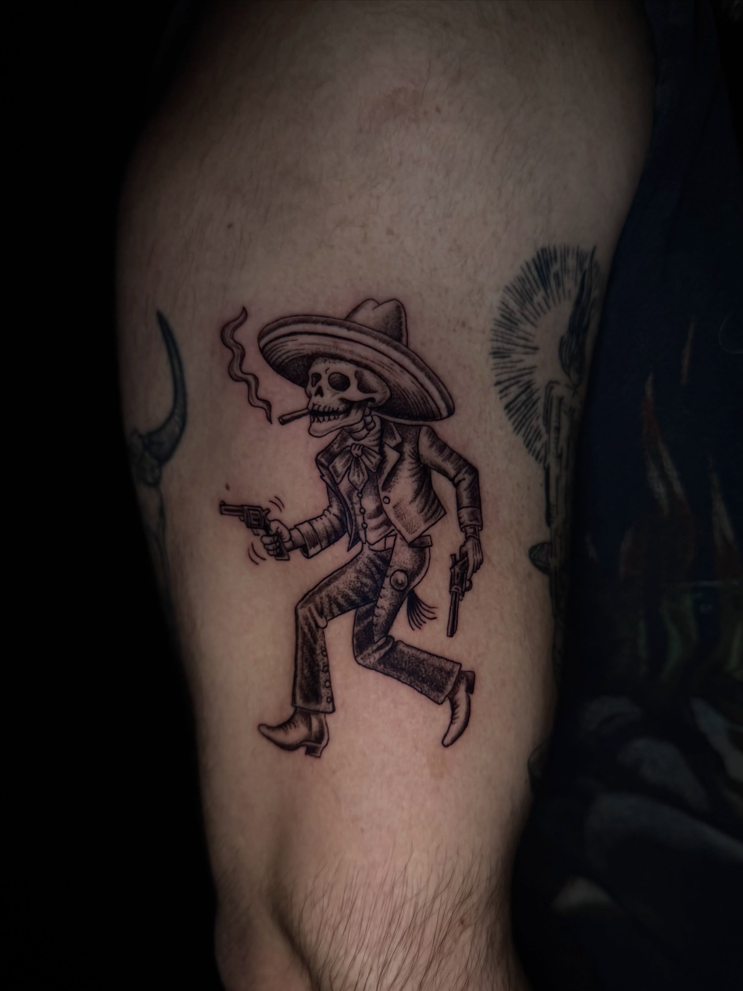 Skeleton in sombrero Chicano tattoo on the thigh by jayla pantig