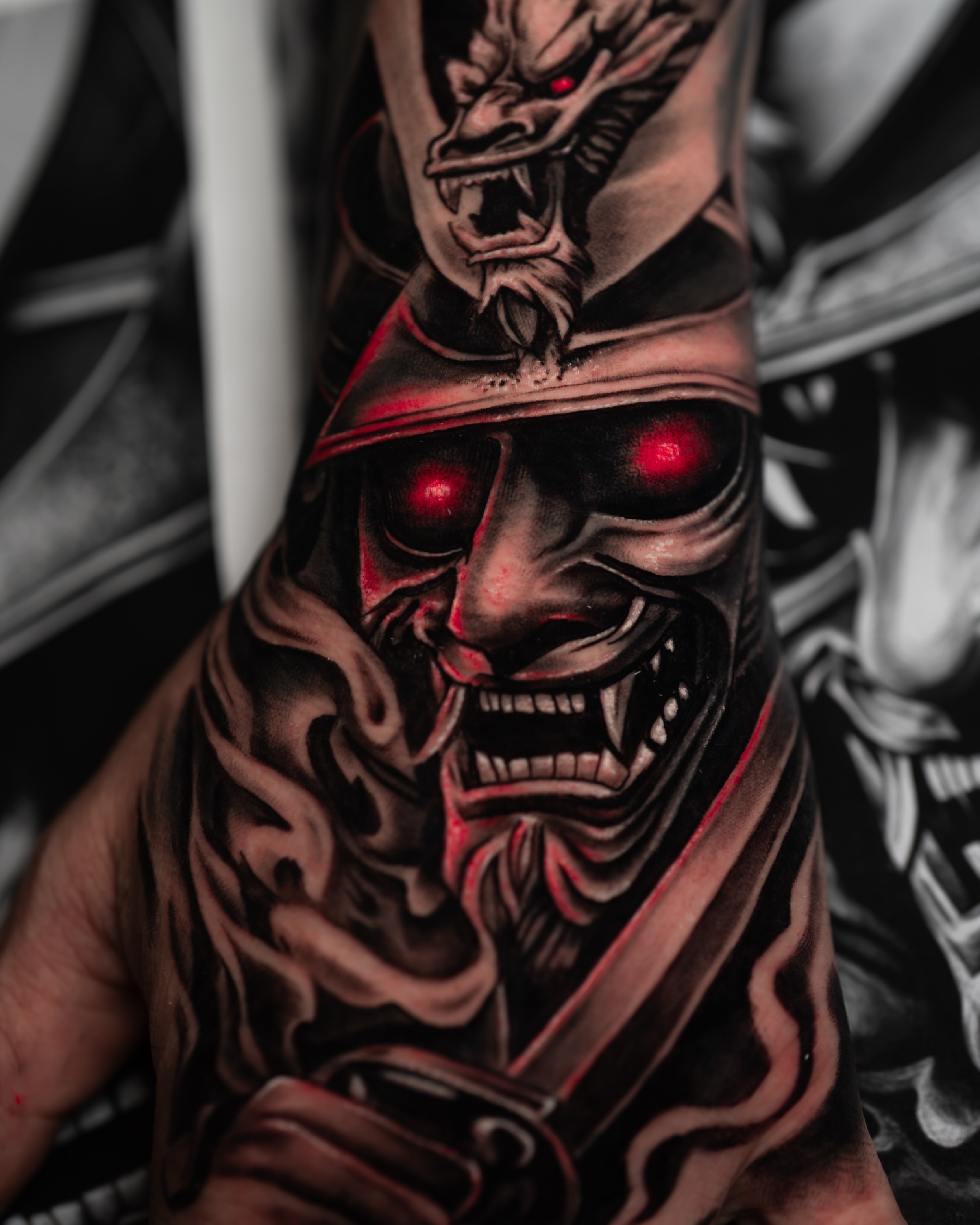 Demon mask dark realism tattoo on the forearm by Javier Chavez