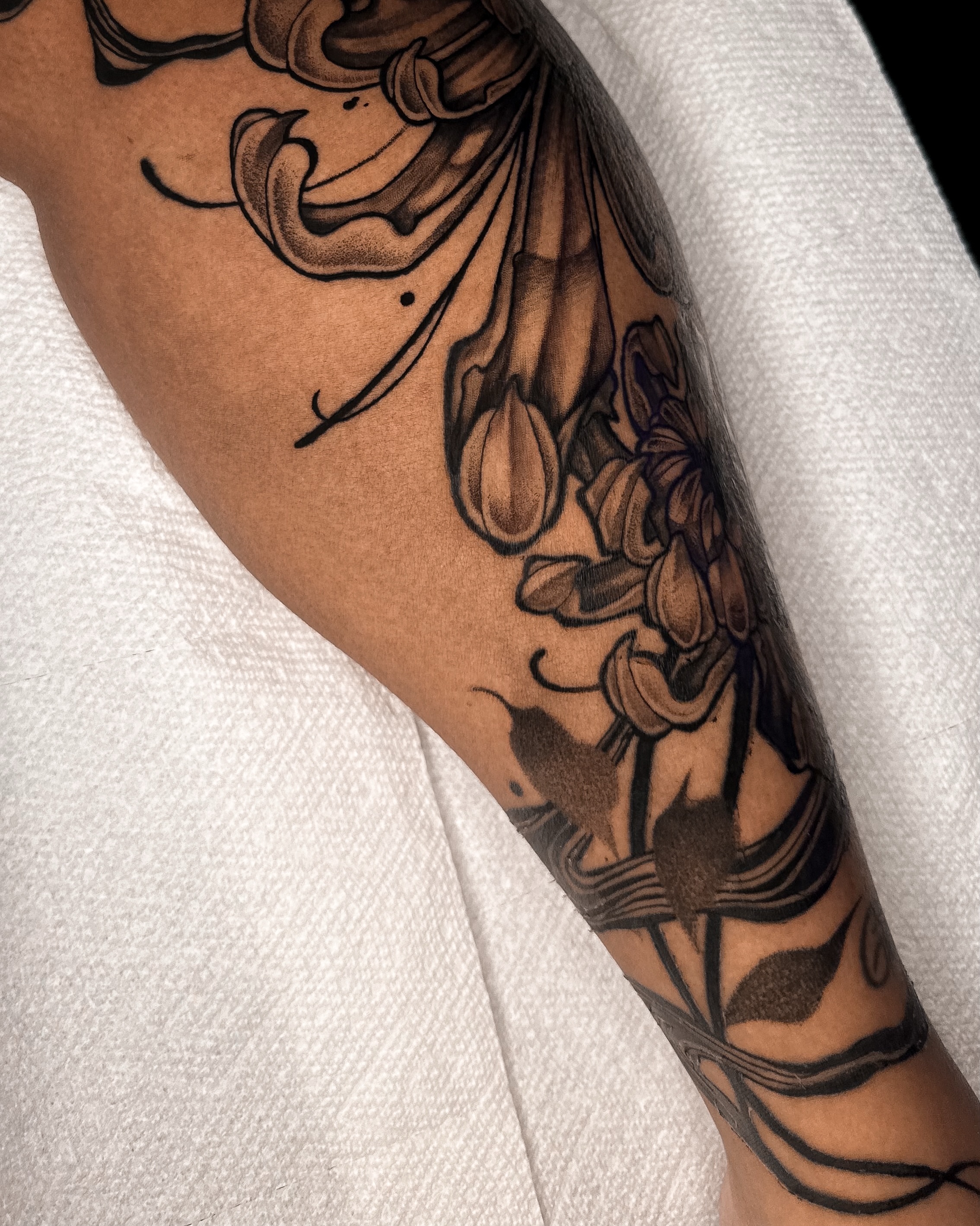Lilies black and grey tattoo on the forearm by Taylin Johnson- Illustrative Blackwork, Columbus, Ohio