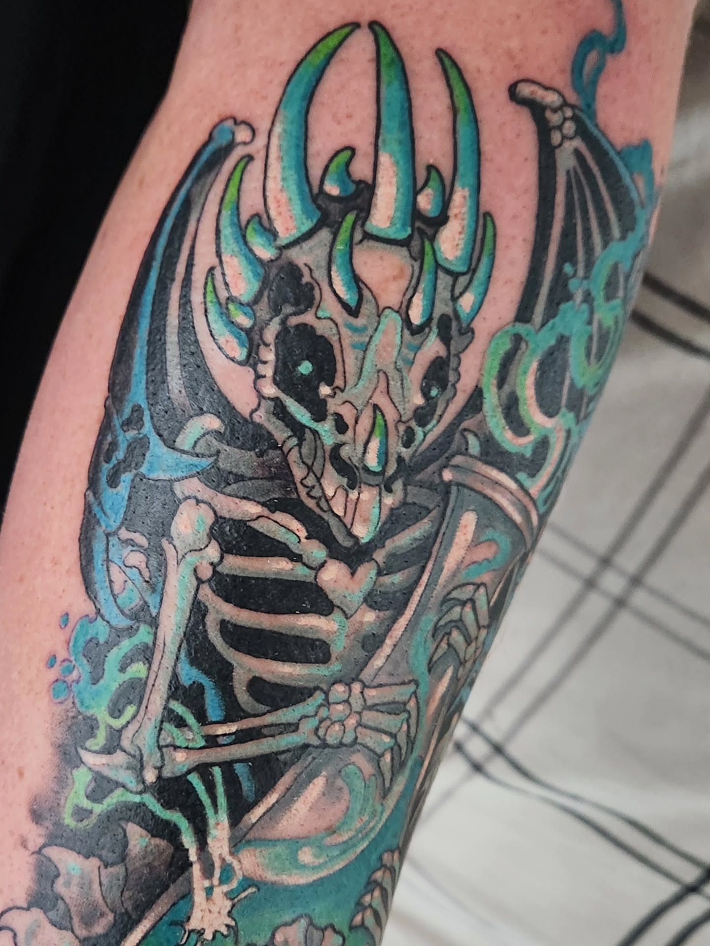 Skeleton with horns dark realism tattoo on the forearm by Randy