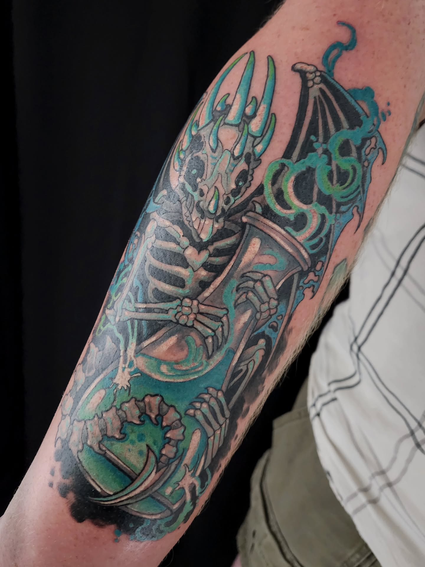 Skeleton with wings neo-traditional tattoo on the forearm by Randy