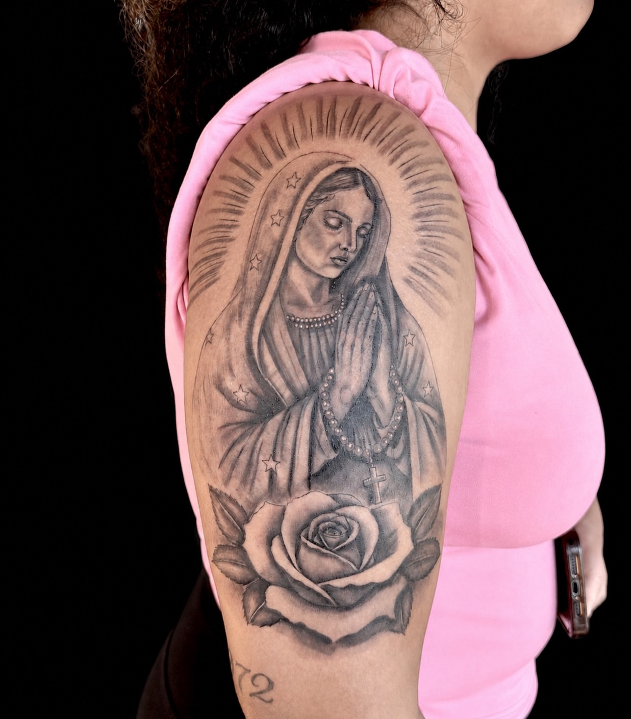 Praying woman realism tattoo on the upper arm by Alex Cantor