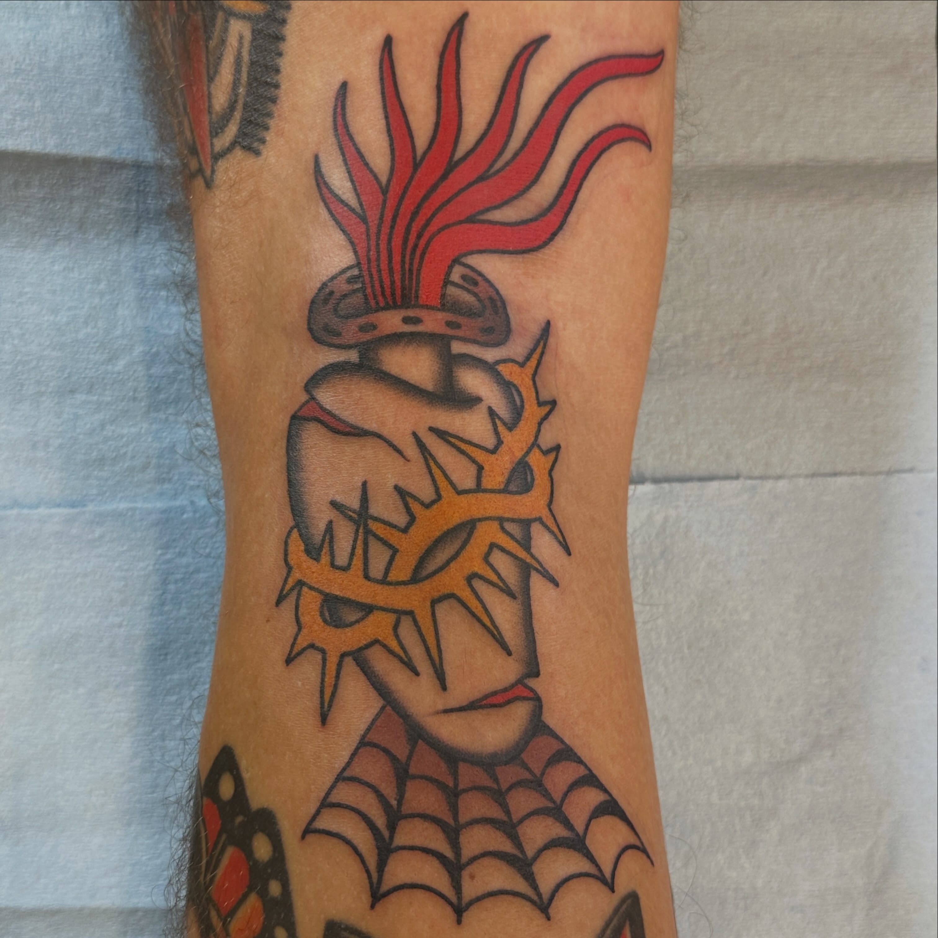Heart with crown American traditional tattoo on the forearm by Kyle Logan Frary
