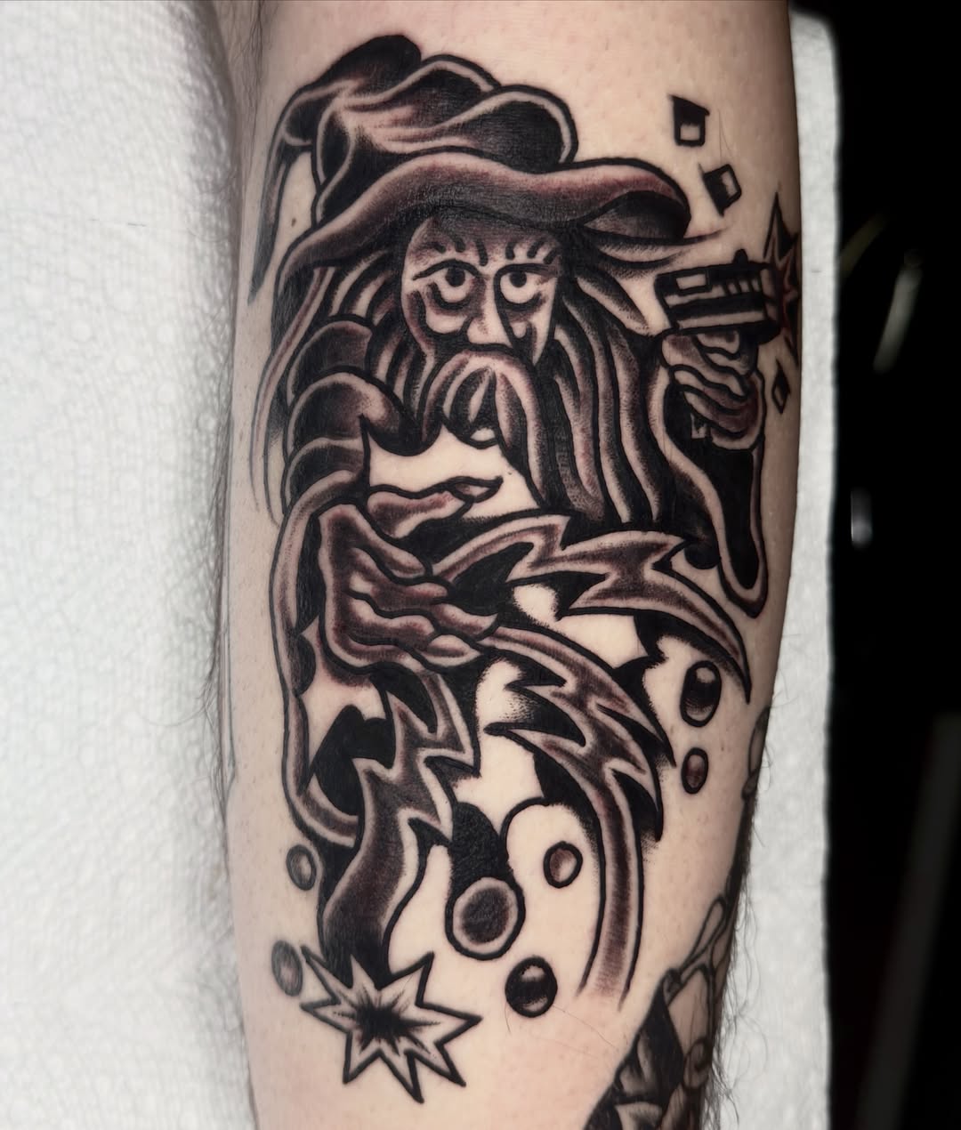 Wizard American traditional tattoo on the forearm by Butz Tattoos